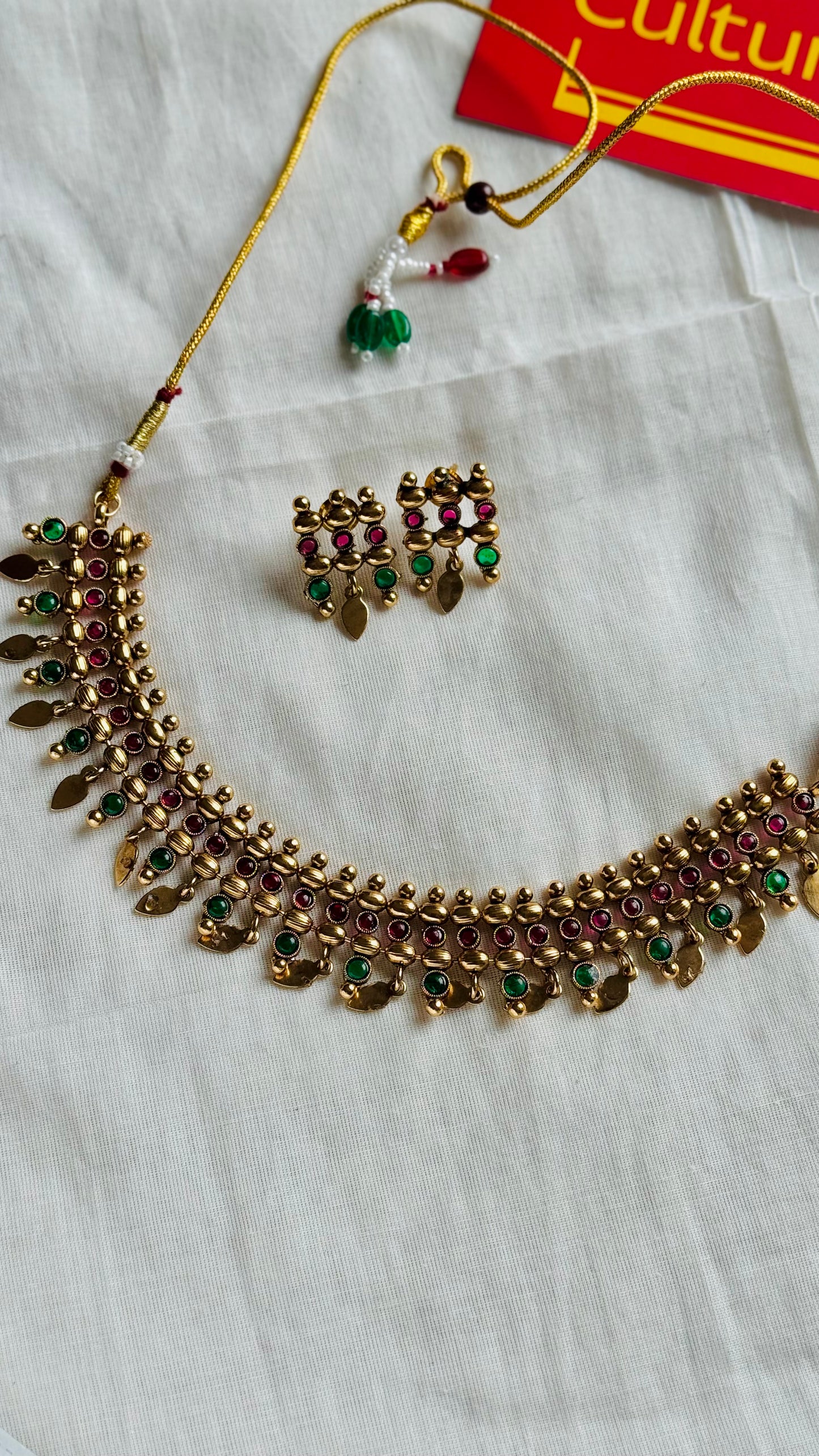 Elakkathali with ruby and green stones, with earrings - YCGPNP788