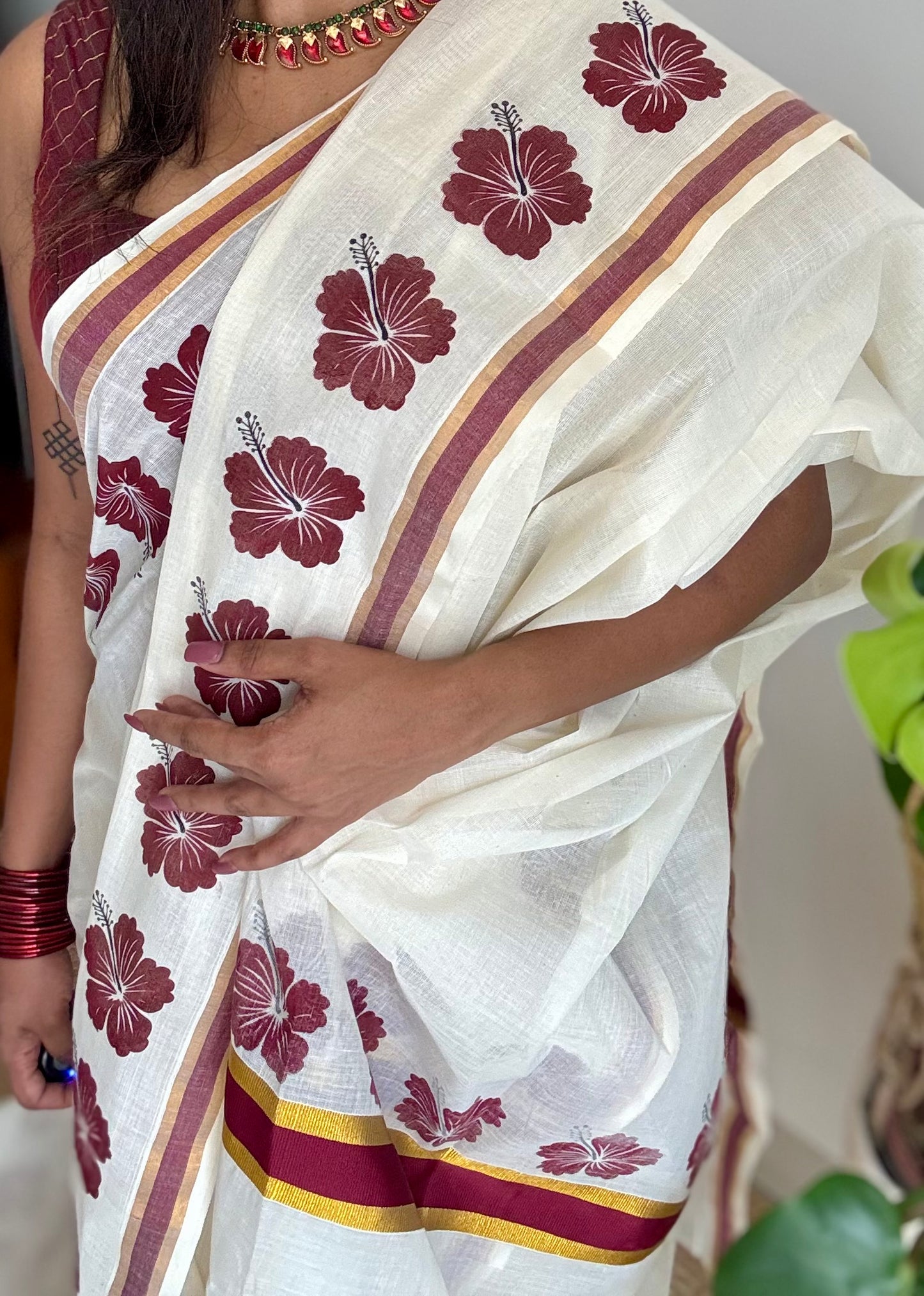 Ivory and gold soft cotton saree, maroon hibiscus (chembarathi) flowers - YCIEON62