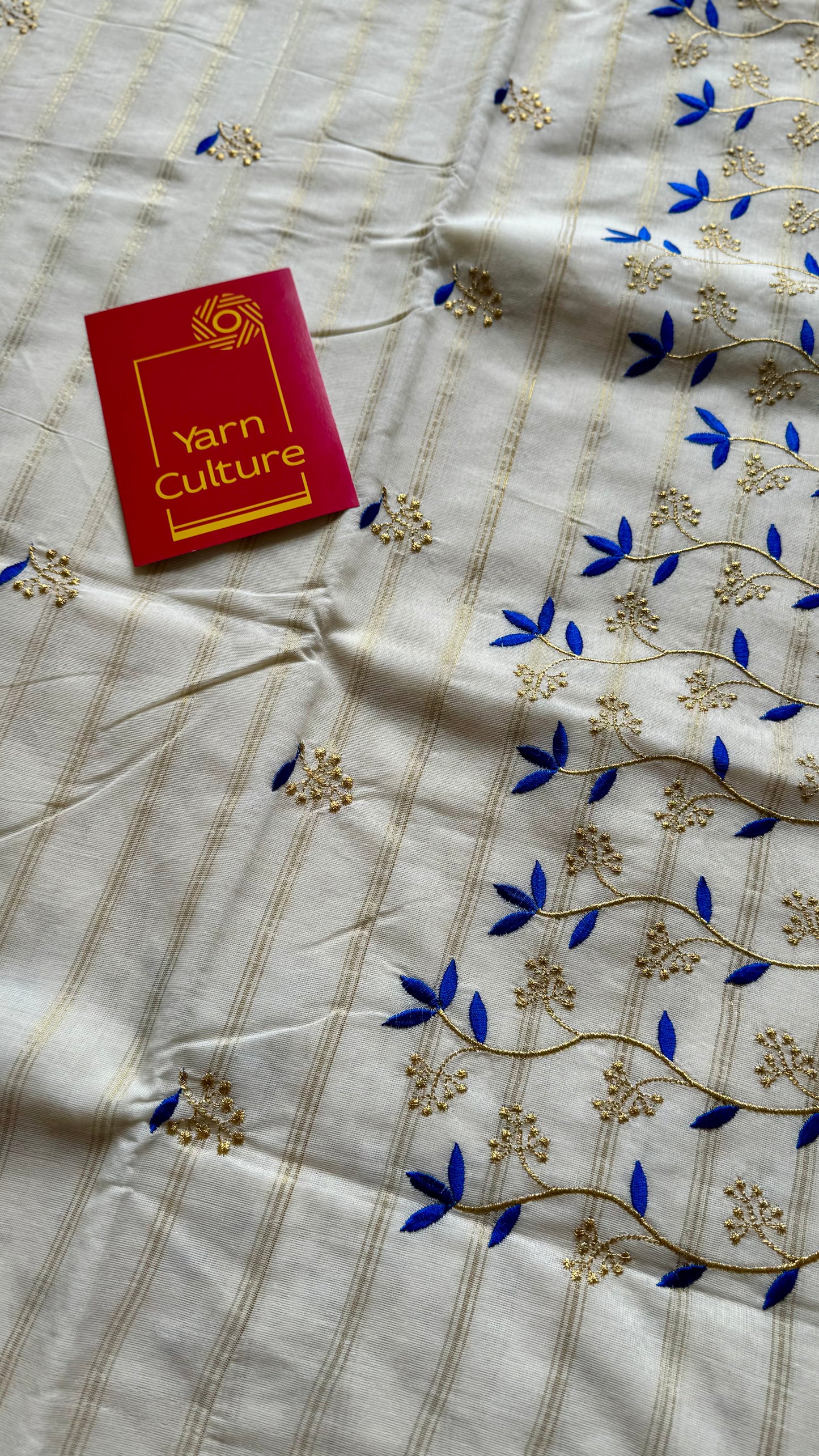 Ivory and gold soft cotton saree, blue floral vine embroidery  - YCIEON55