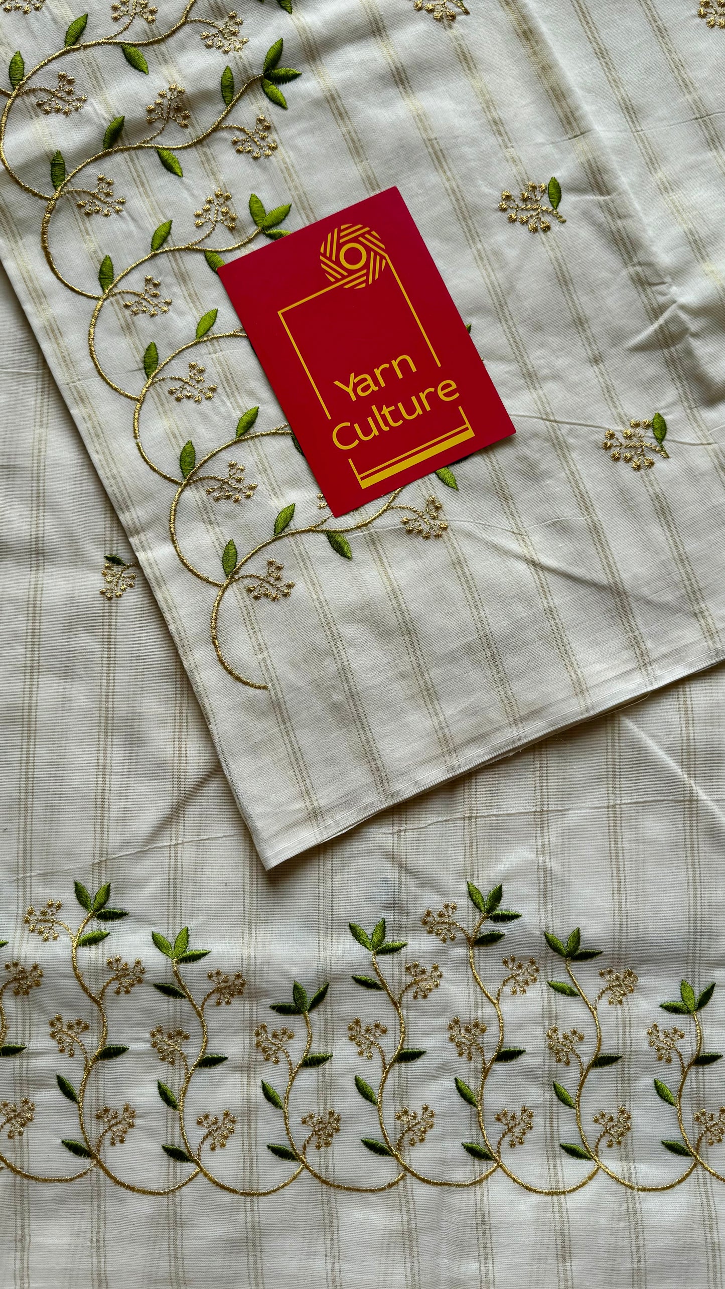 Ivory and gold soft cotton saree, light green floral vine embroidery - YCIEON59