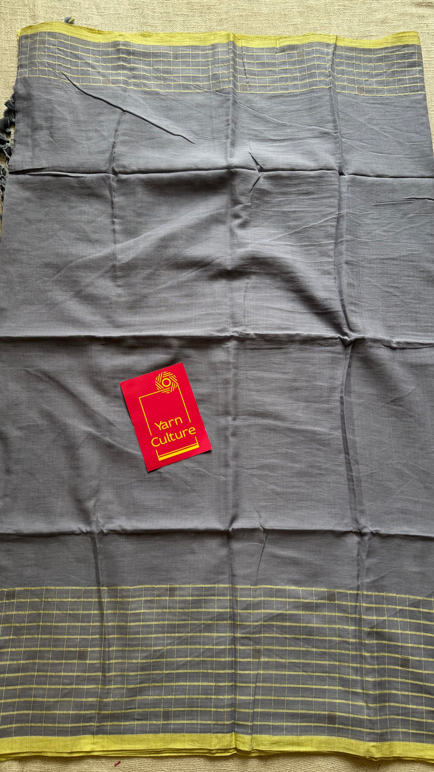 Grey handloom mul saree with custard yellow checkered borders and antique gold buttas - YCBCMCFE387