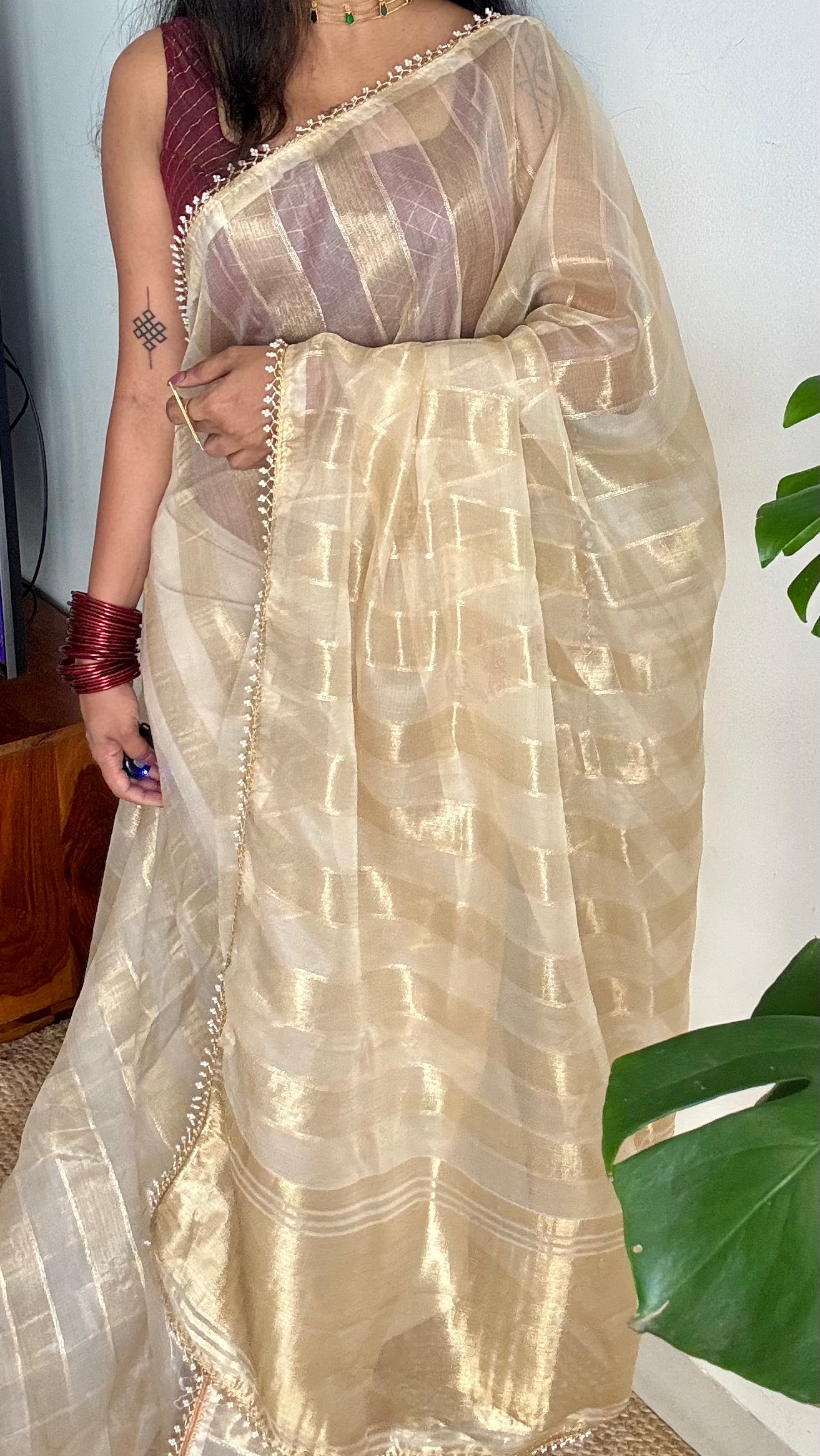 Gold soft semi tissue saree, striped body, pearl embellished border - YCIEON83