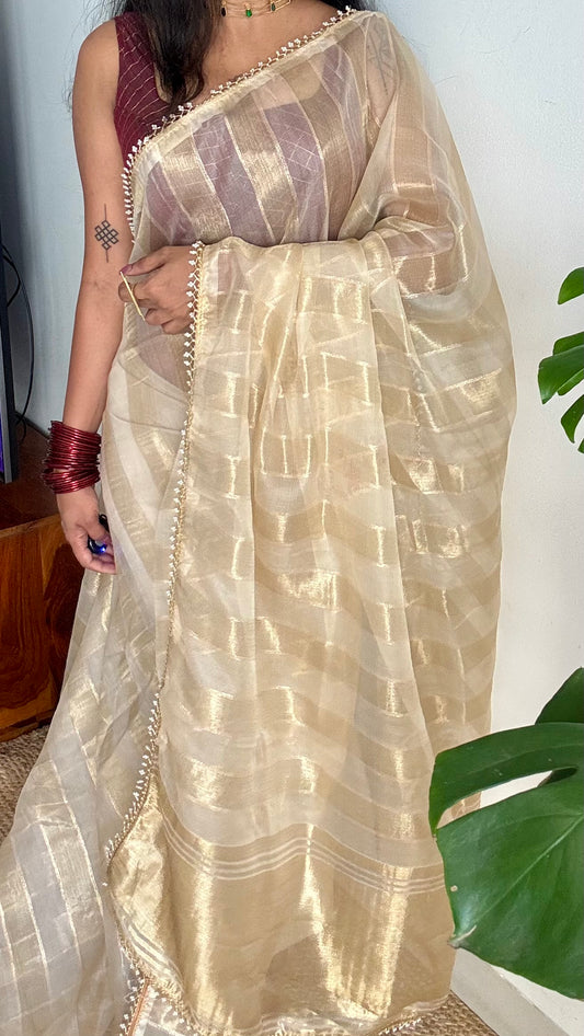 Gold soft semi tissue saree, striped body, pearl embellished border - YCIEON83