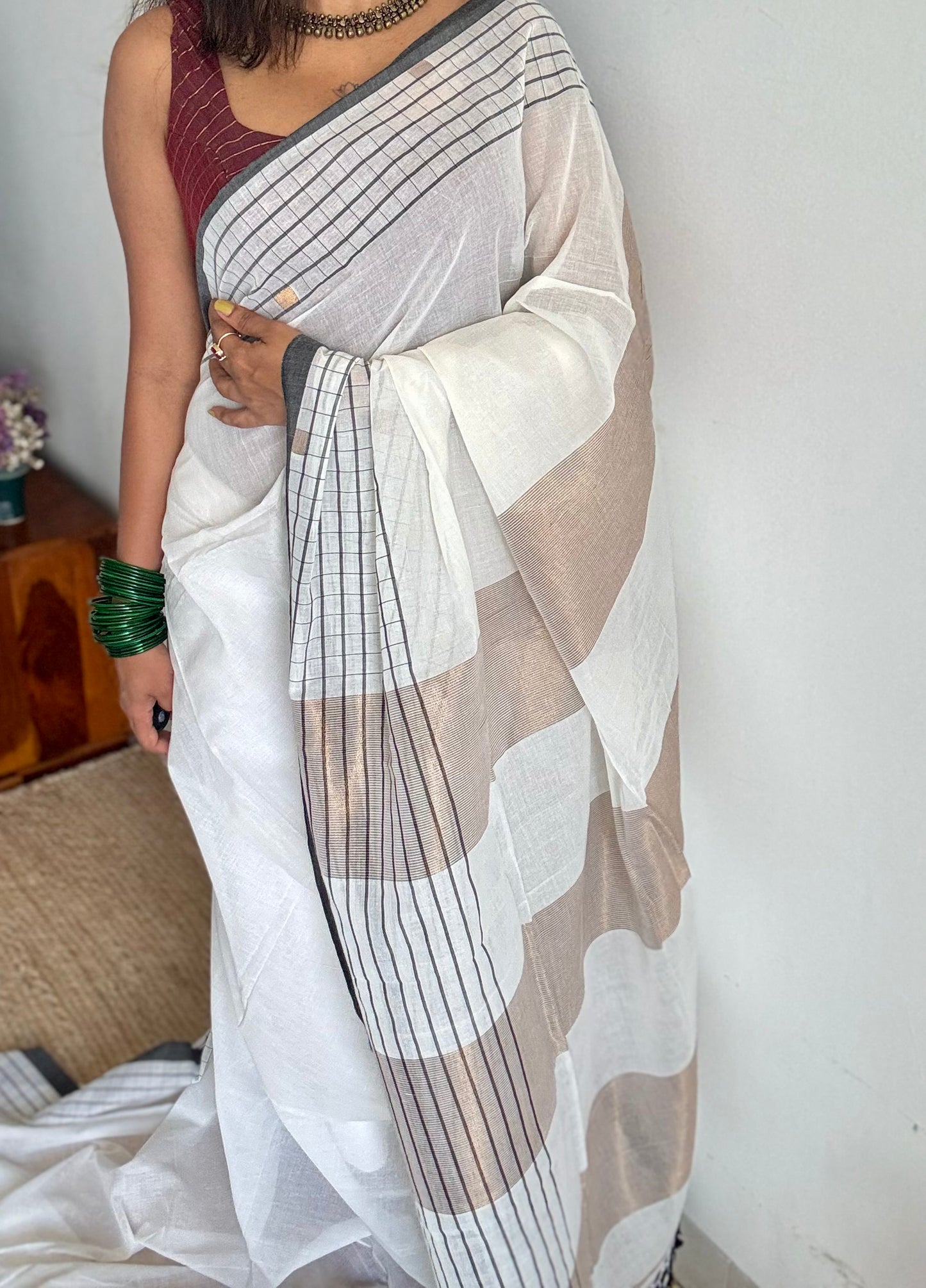 Ivory handloom mul saree with black checkered borders and antique gold buttas - YCBCMCFE170