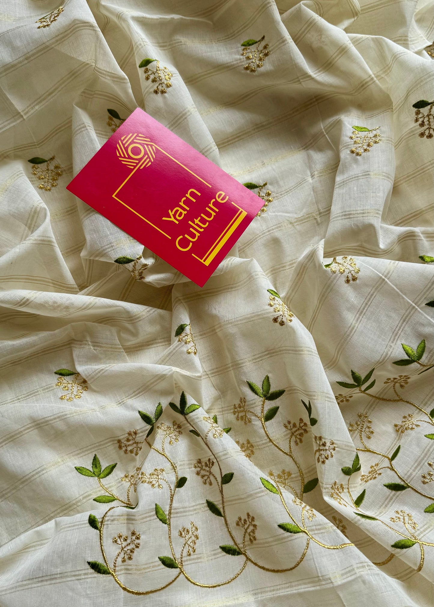 Ivory and gold soft cotton saree, light green floral vine embroidery - YCIEON59