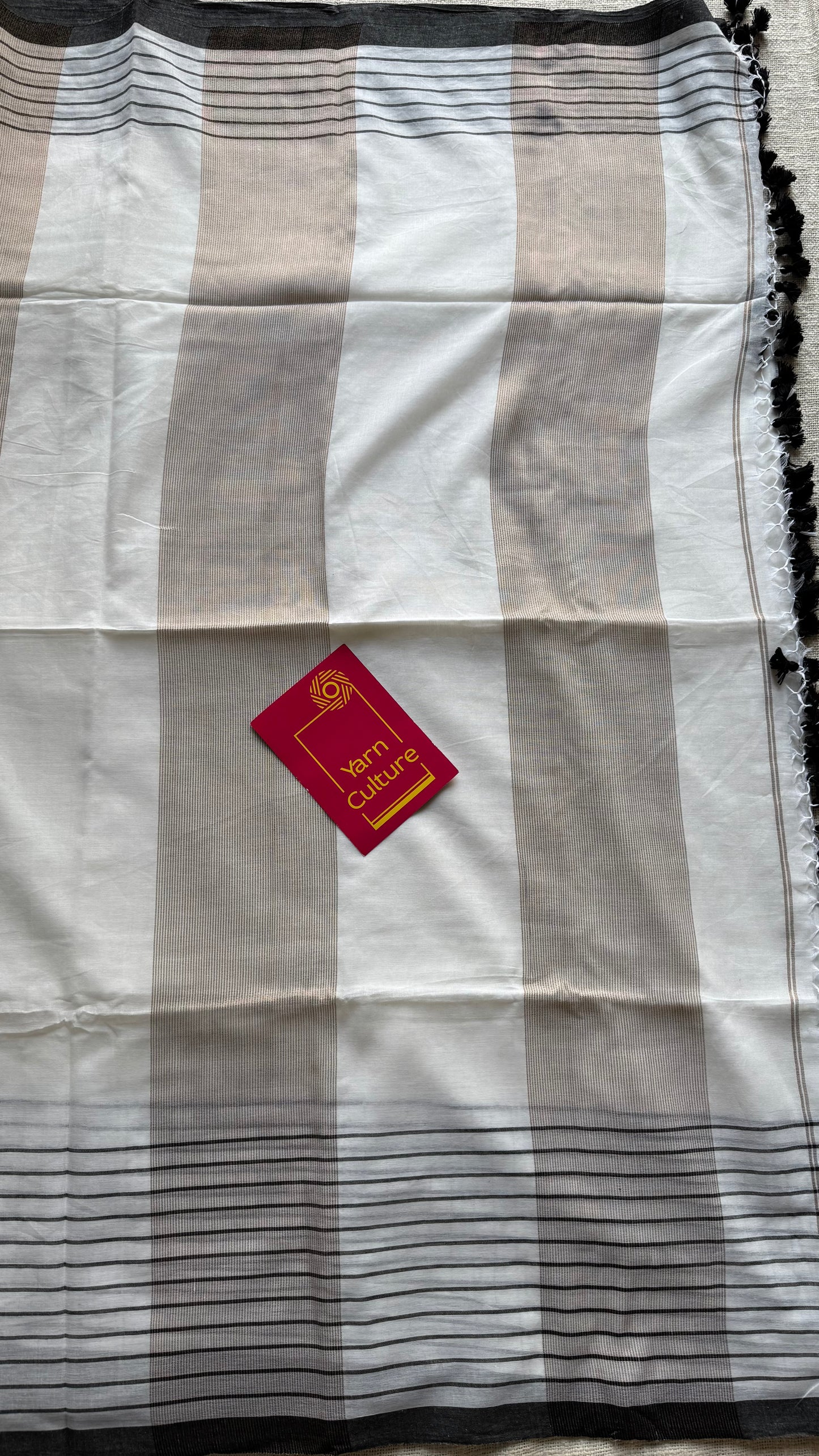 Ivory handloom mul saree with black checkered borders and antique gold buttas - YCBCMCFE170