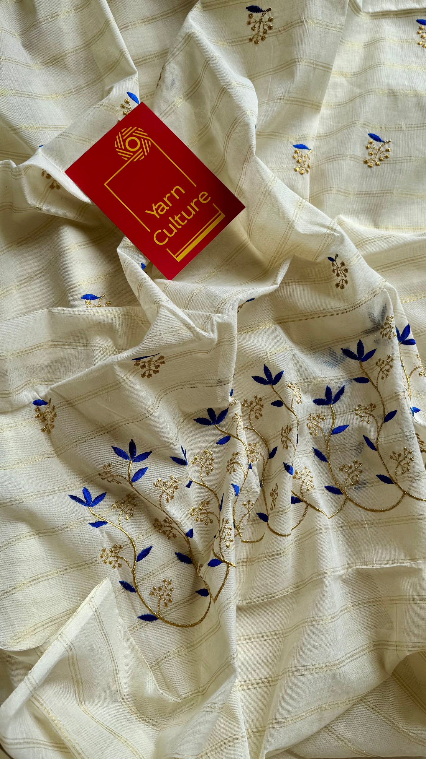 Ivory and gold soft cotton saree, blue floral vine embroidery  - YCIEON55