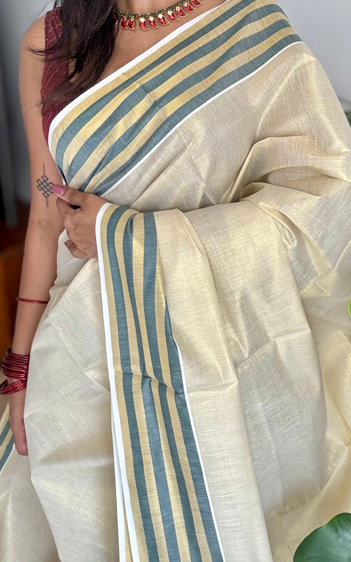 Ivory and gold soft tissue cotton saree, dark green border - YCIEON68