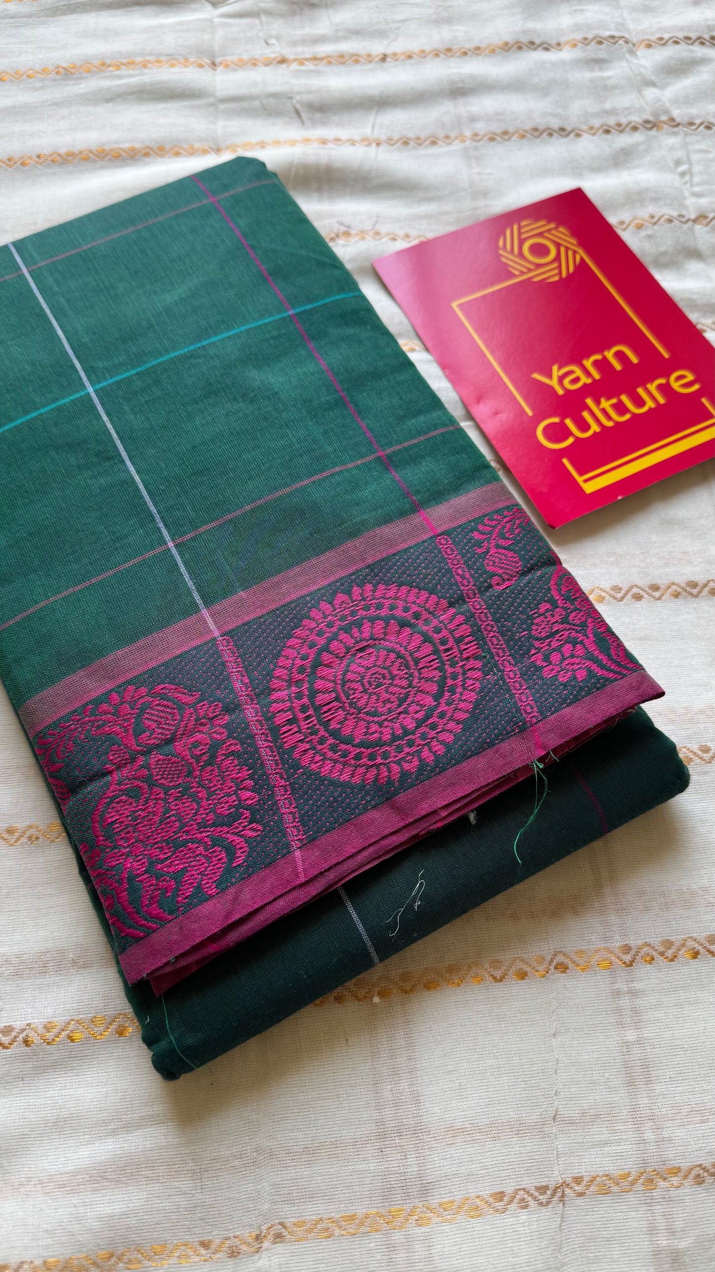 Chettinad cotton saree in dark green with pink checks, thread motif border - YCCOTNJUCC05