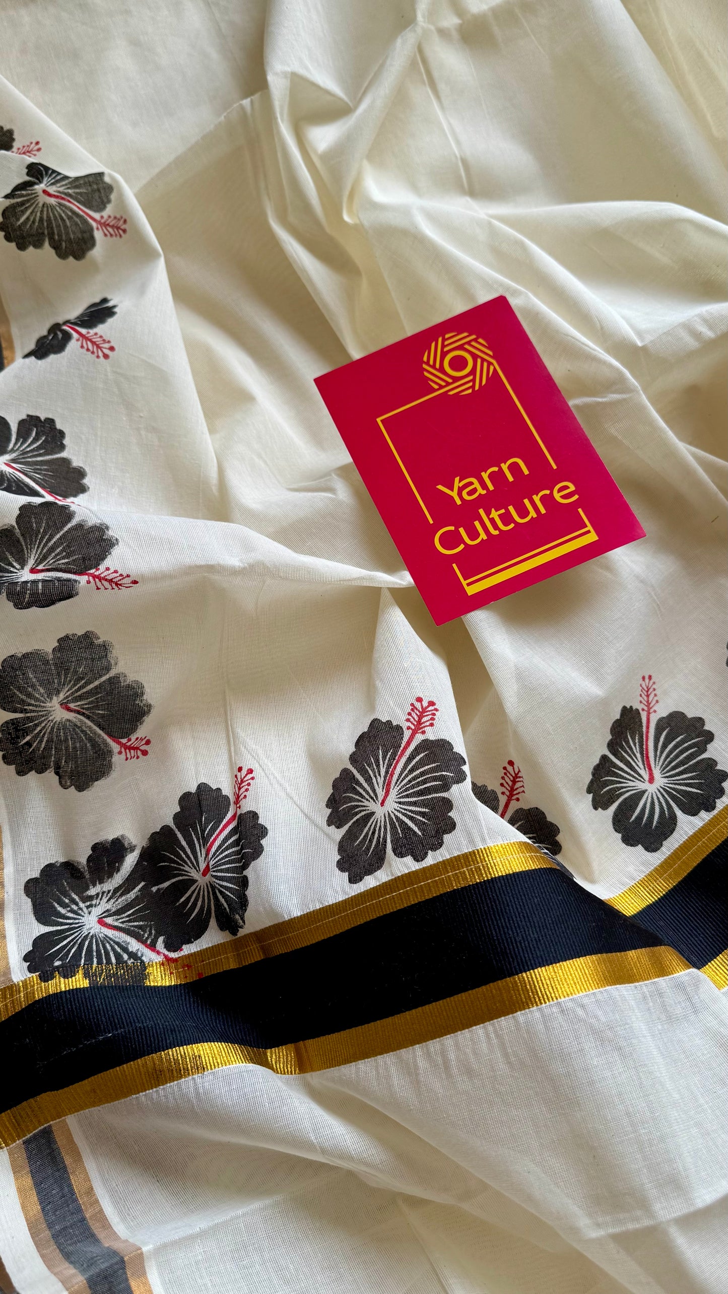 Ivory and gold soft cotton saree, black hibiscus (chembarathi) flowers - YCIEON61