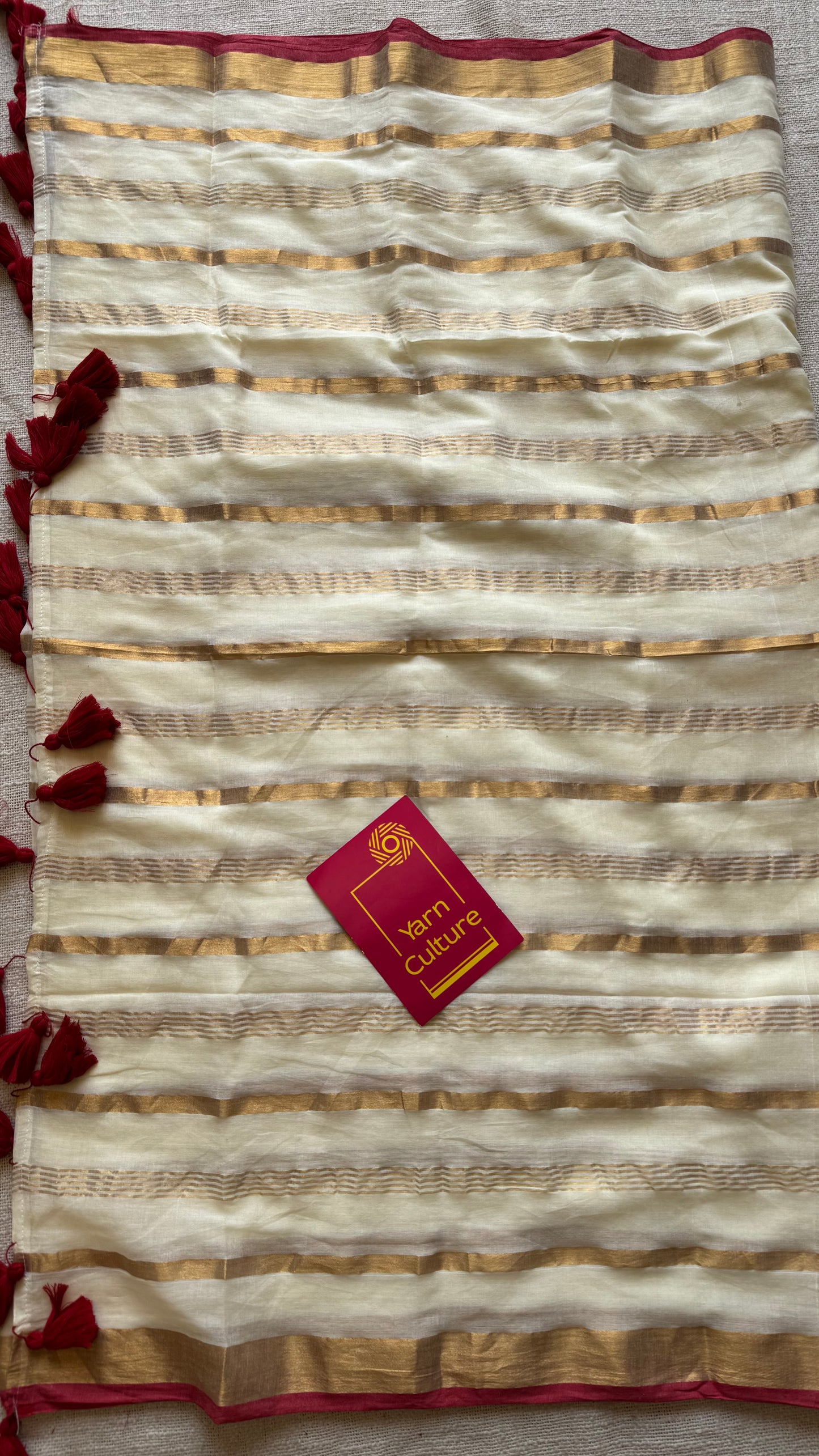 Ivory mul saree with gold stripes and red border - YCIEBCFE327