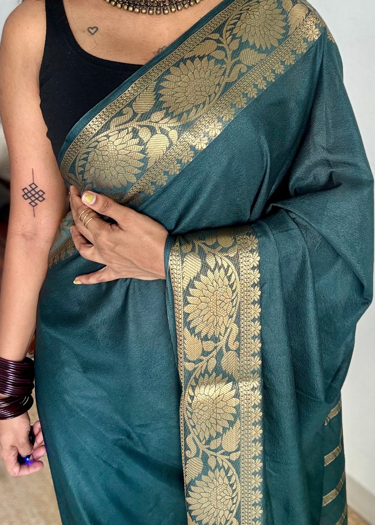 Dark green, semi crepe silk saree with antique gold floral border - YCLOKOC57
