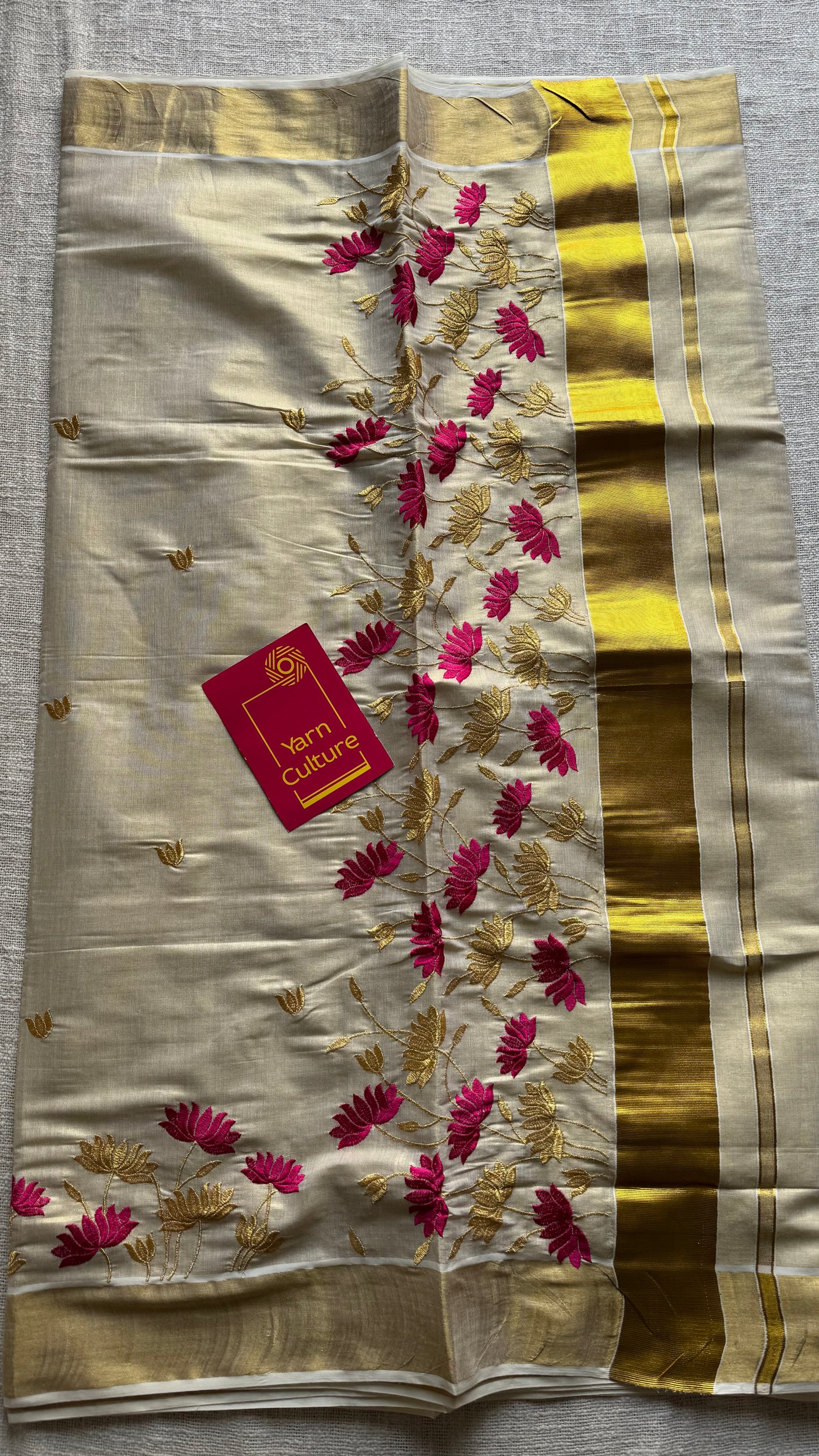 Ivory and gold tissue kerala cotton saree with hot pink and gold lotus embroidery - YCIEKCFE315
