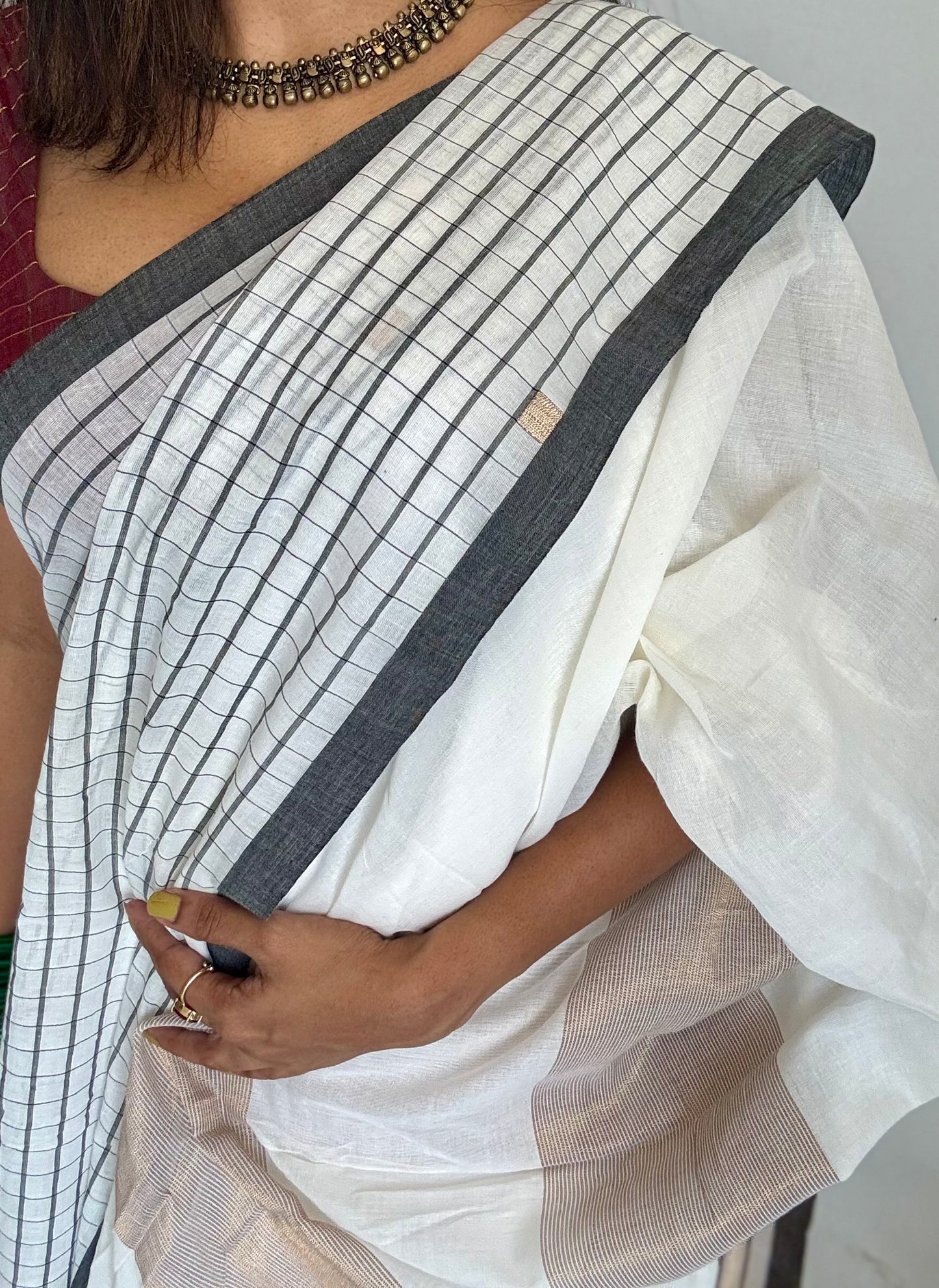 Ivory handloom mul saree with black checkered borders and antique gold buttas - YCBCMCFE170
