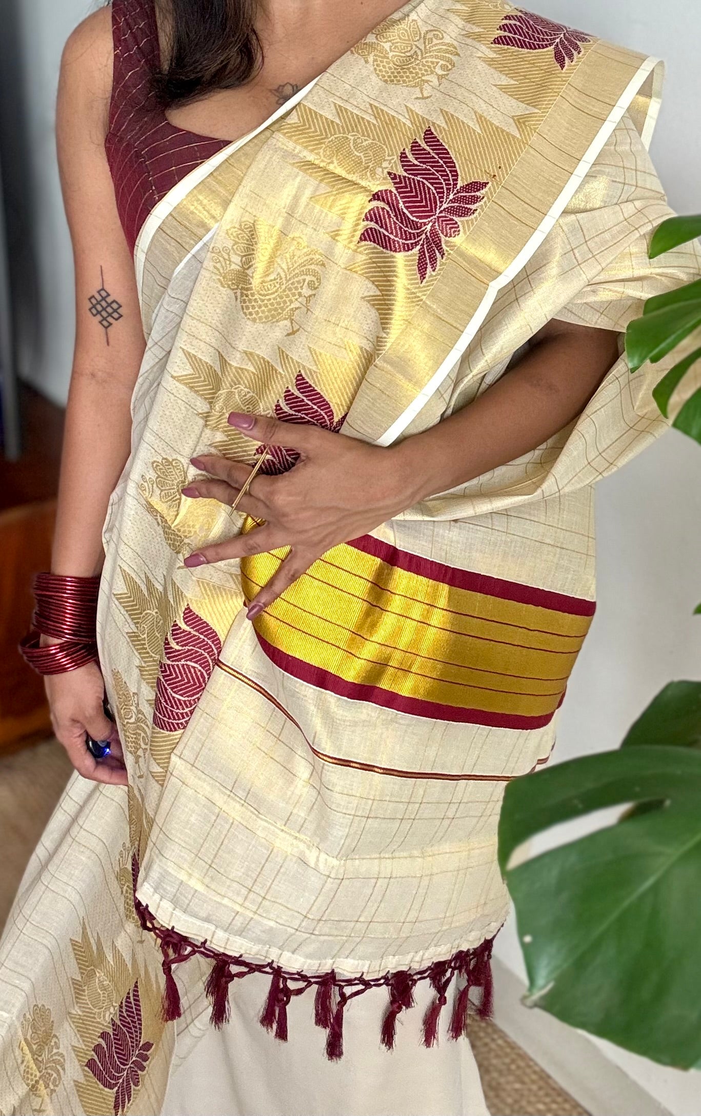 Ivory and gold kerala kasavu saree, maroon lotus motif border - YCIEON48