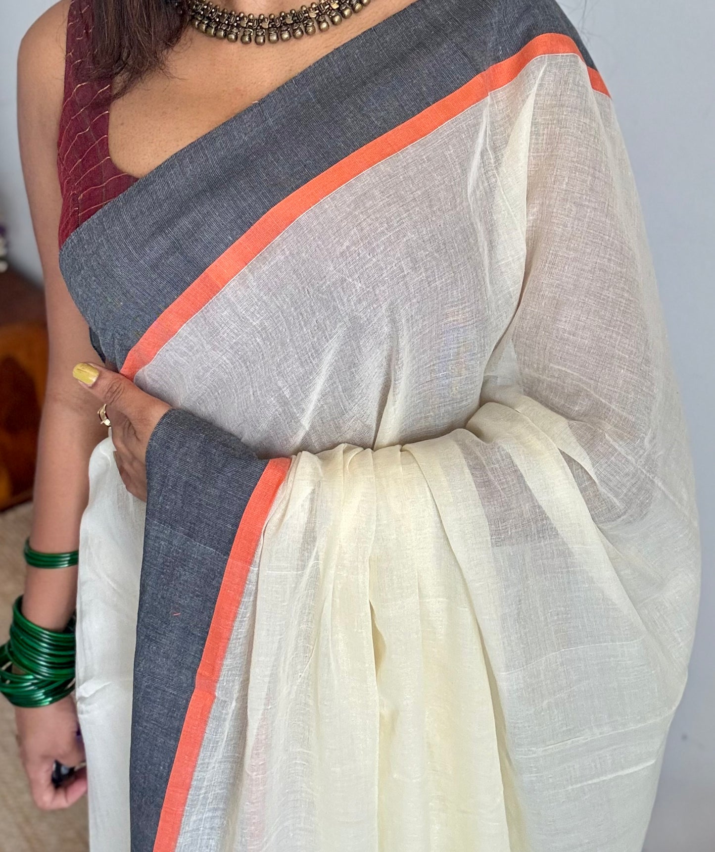 Ivory mul saree with black and orange border - YCBCMCFE293