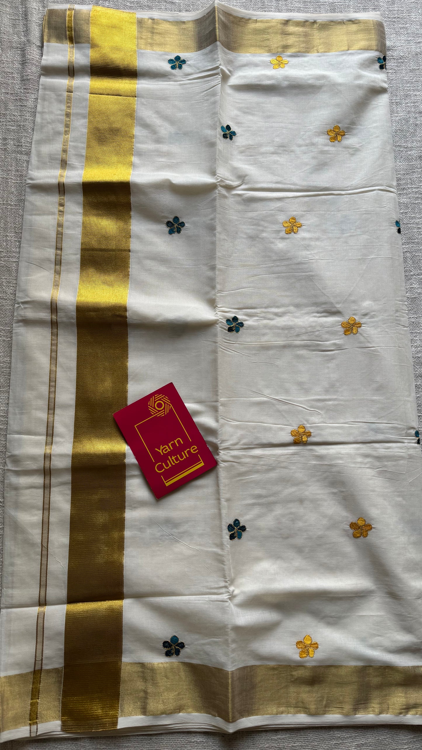 Ivory and gold saree with peacock blue and yellow floral embroidery - YCIEKCFE309