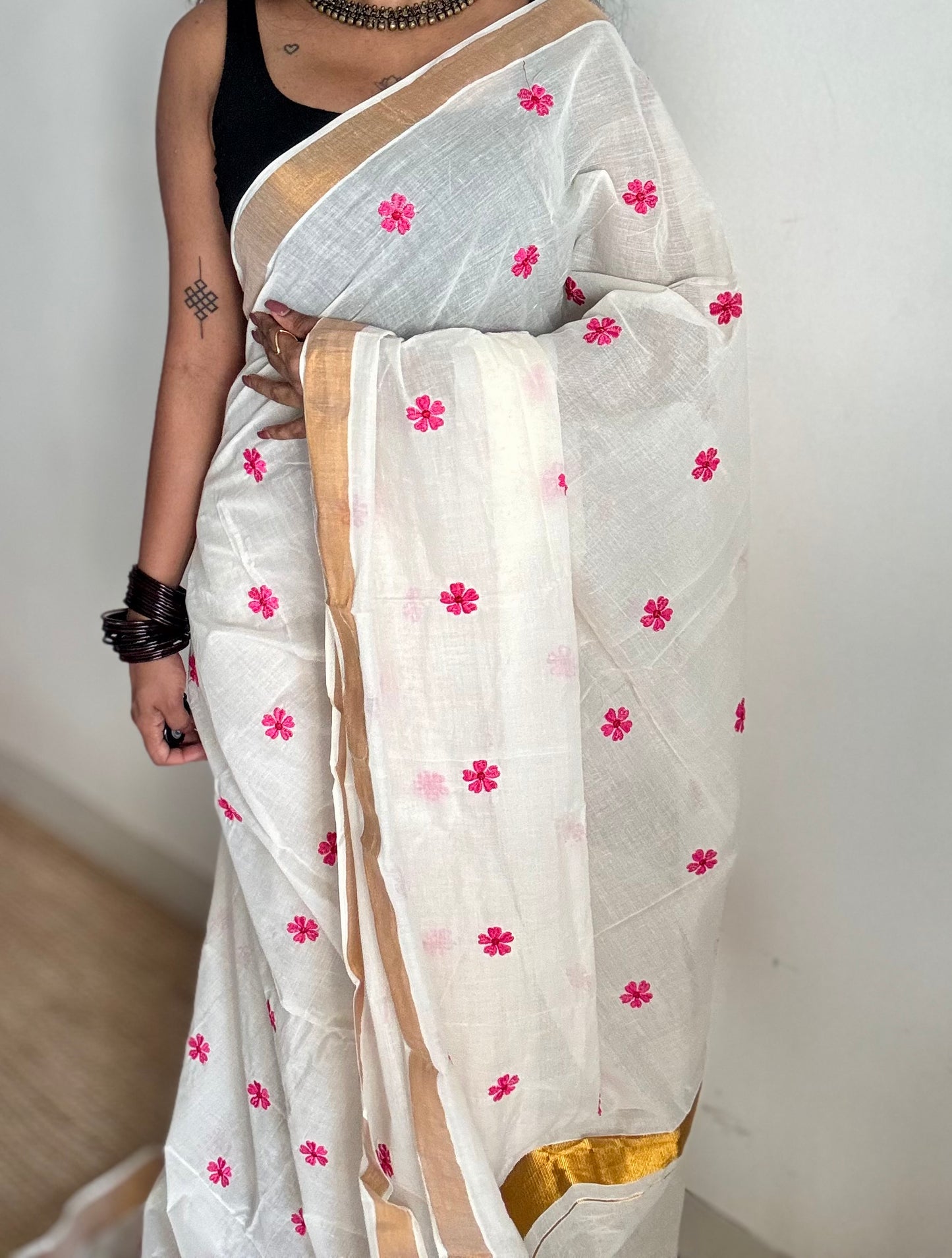Ivory and antique gold soft cotton kasavu saree, pink parijat floral embroidery - YCIEON155