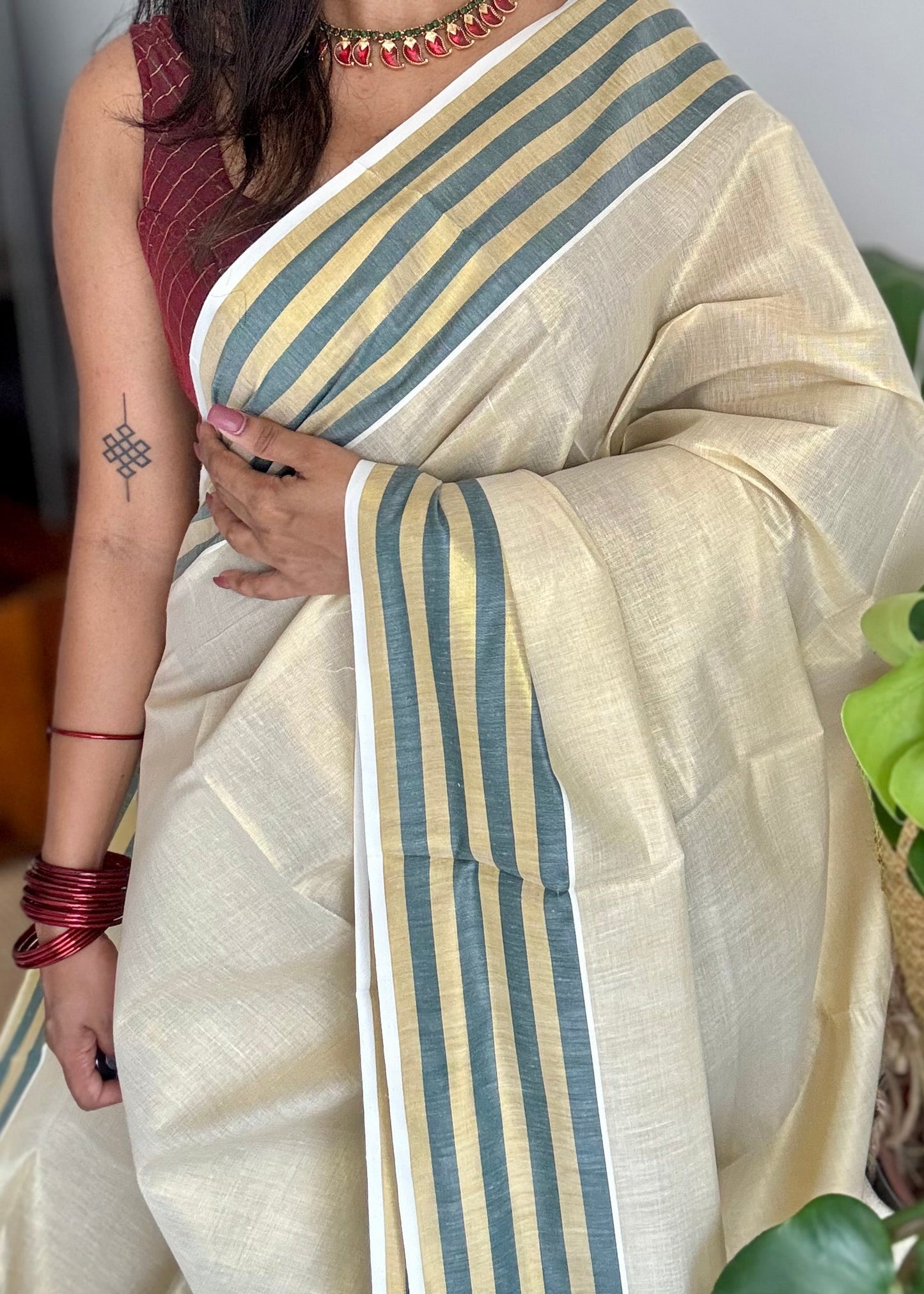 Ivory and gold soft tissue cotton saree, dark green border - YCIEON68