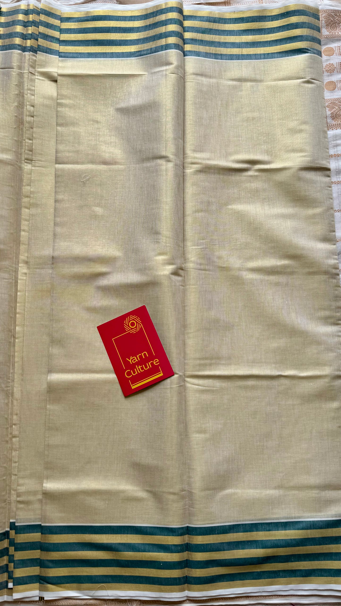 Ivory and gold soft tissue cotton saree, dark green border - YCIEON68