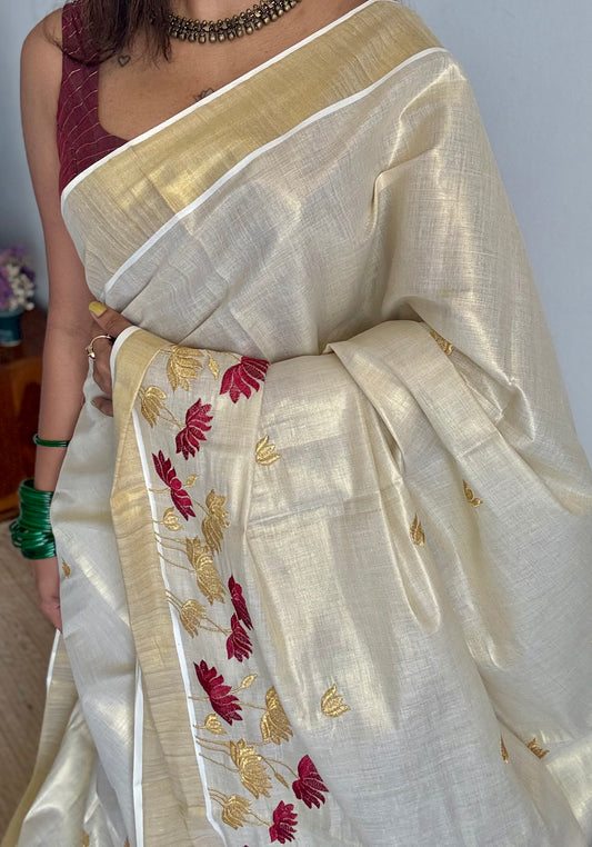 Ivory and gold tissue kerala cotton saree with maroon and gold lotus embroidery - YCIEKCFE316