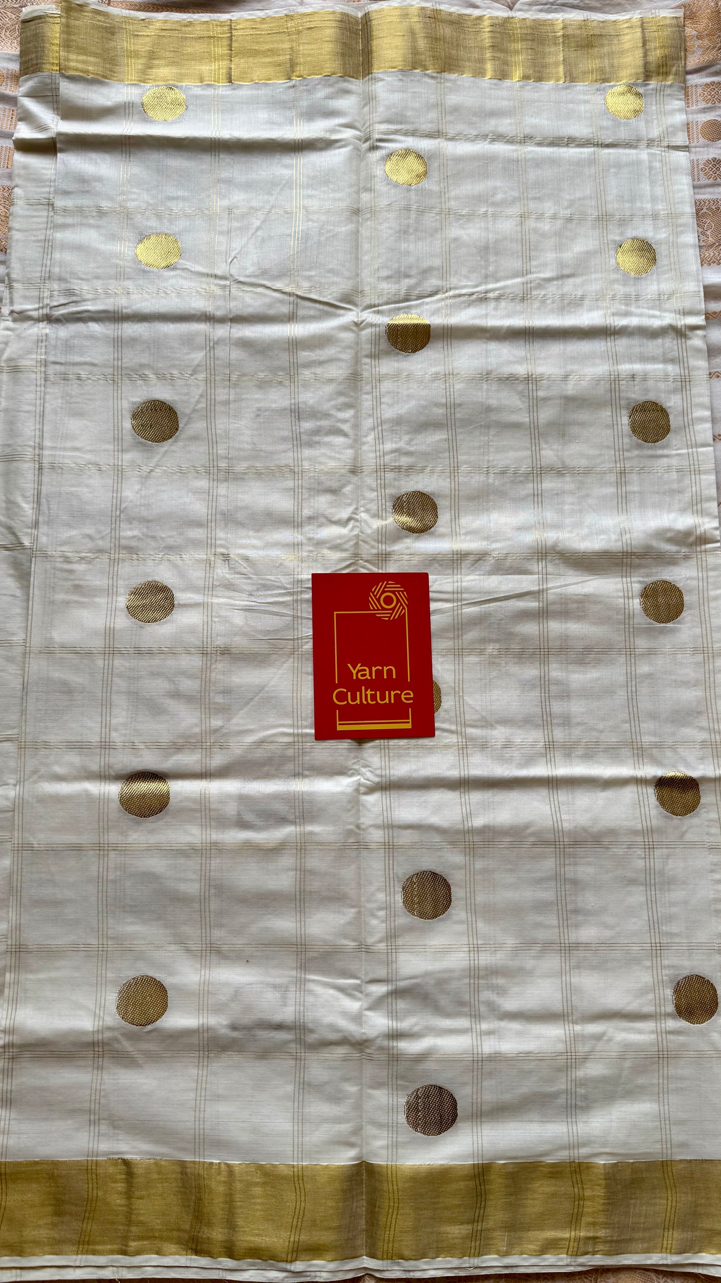 Ivory and gold kerala saree with gold buttas and checks - YCIEON41