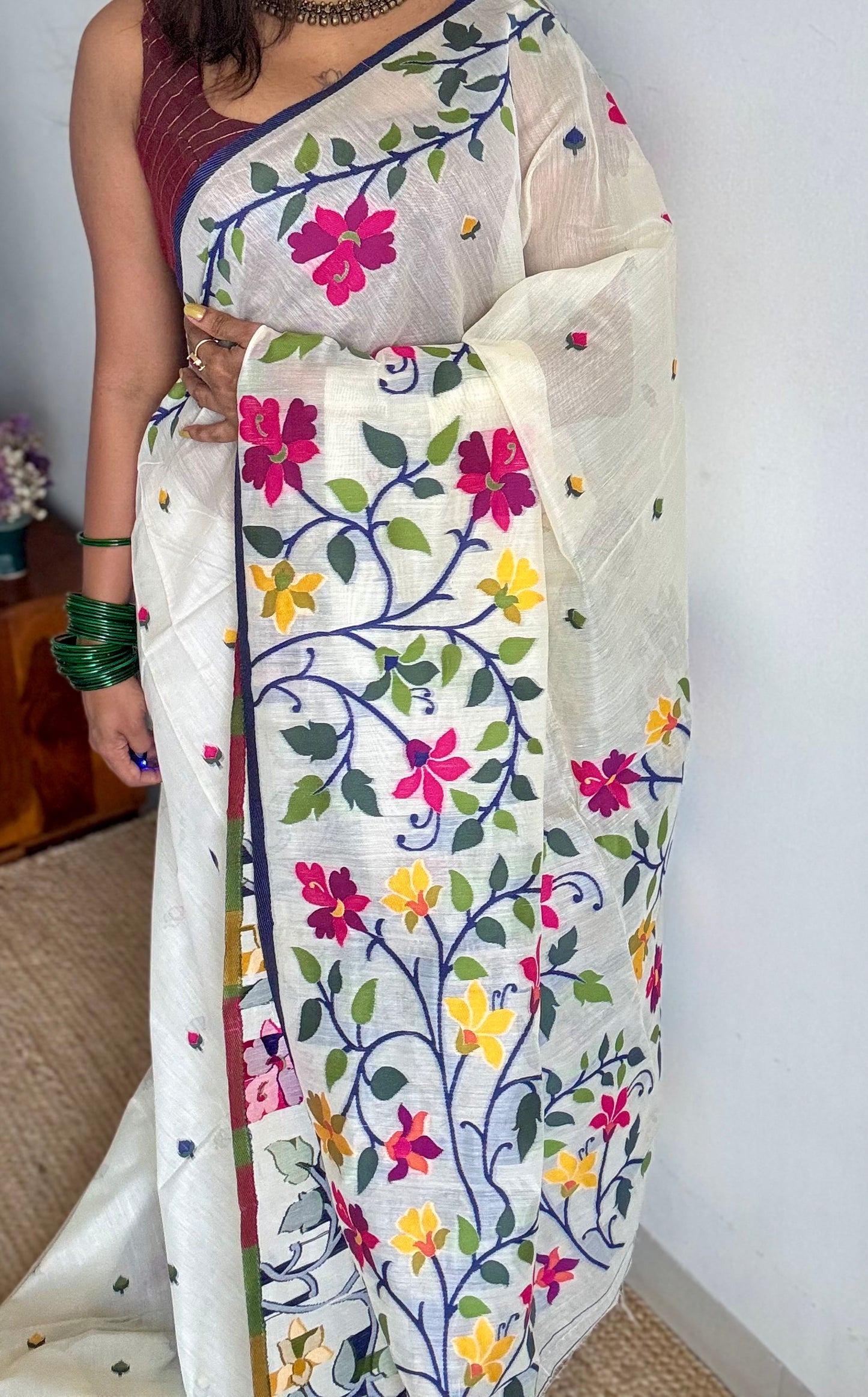 Ivory with navy blue border and multicolour floral motifs, cotton saree - YCIEBCFE325