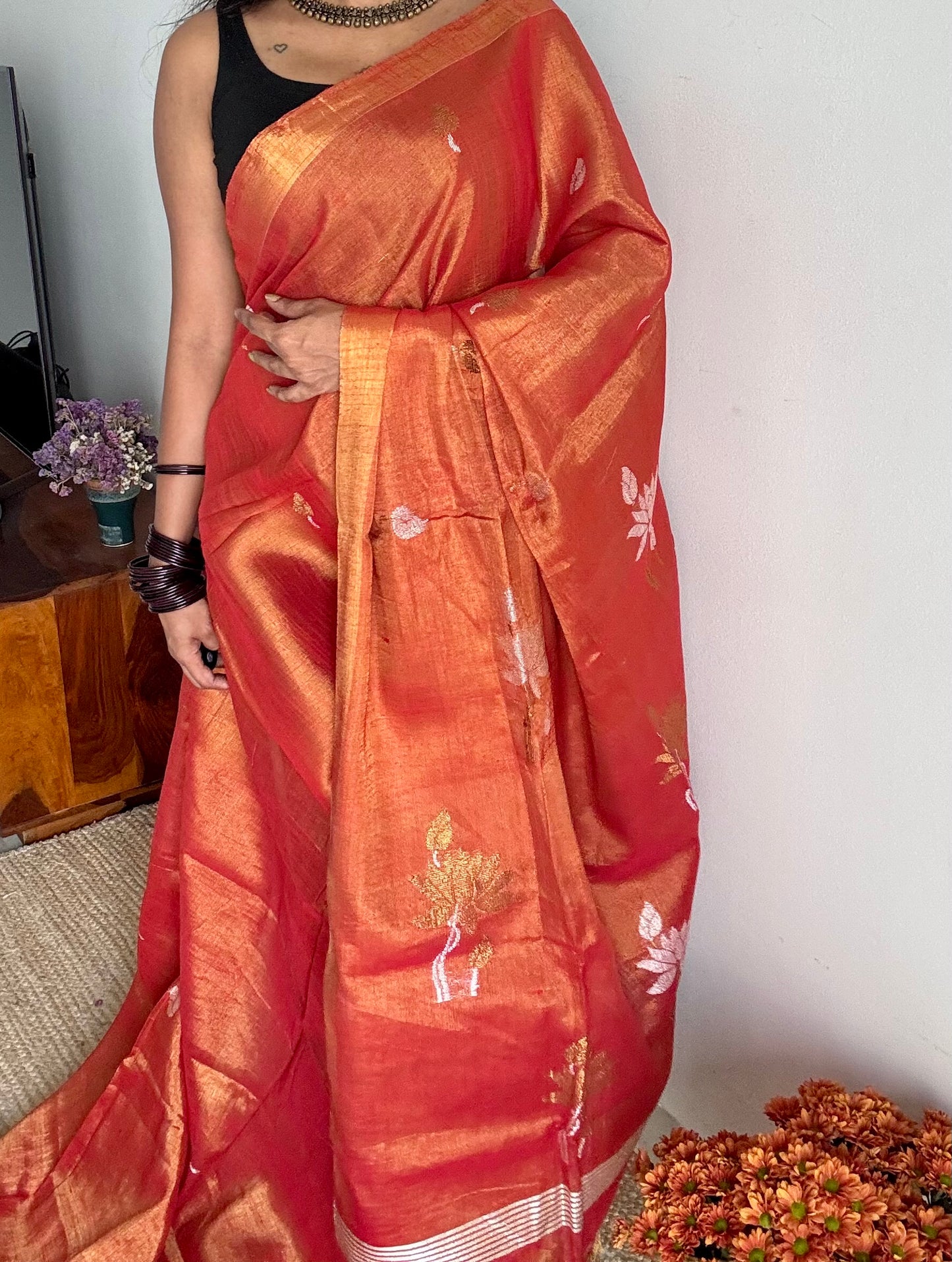 Handwoven orange gold dual tone tissue linen saree with lotus motifs - YCBCLTFE399