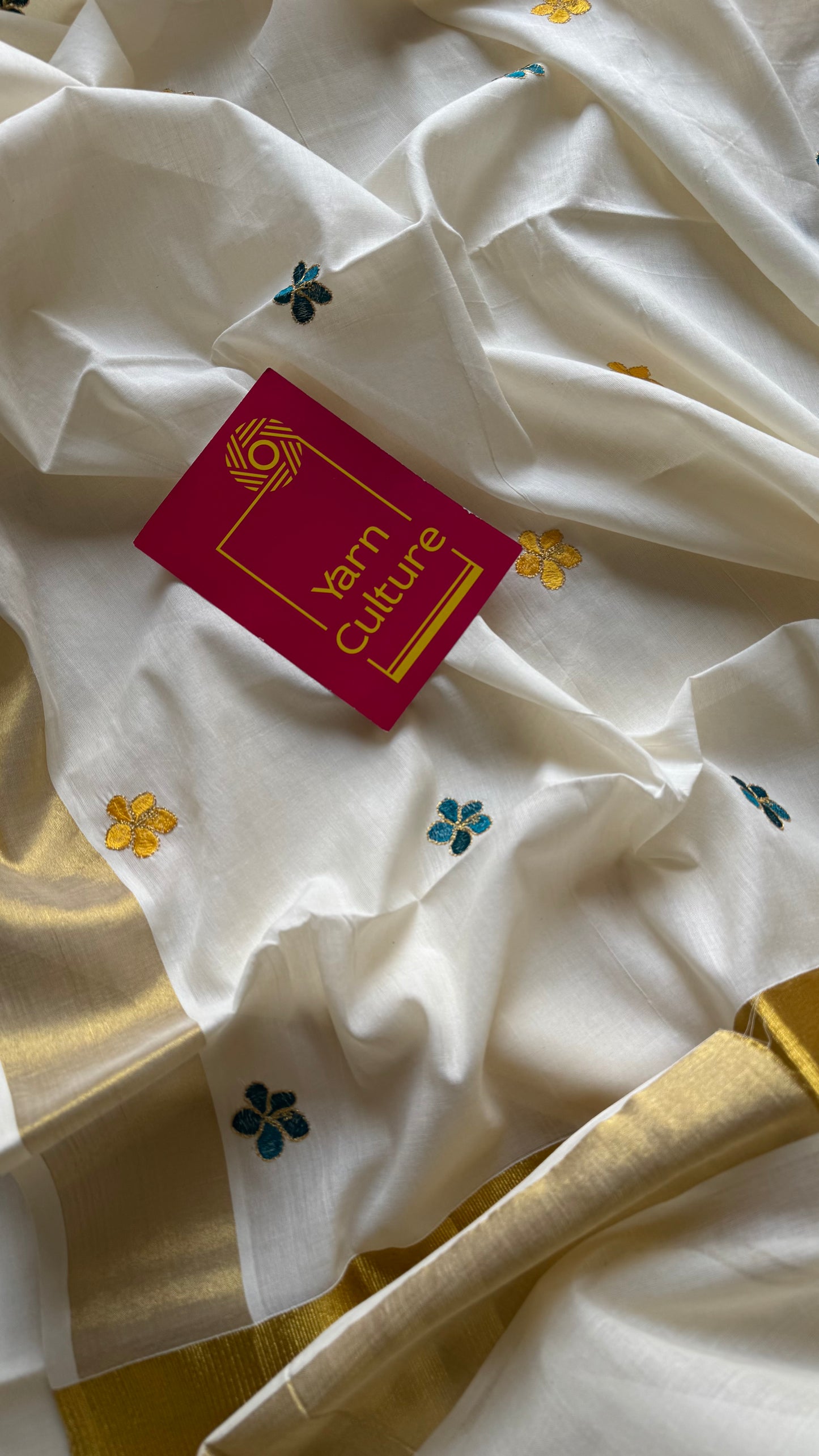 Ivory and gold saree with peacock blue and yellow floral embroidery - YCIEKCFE309