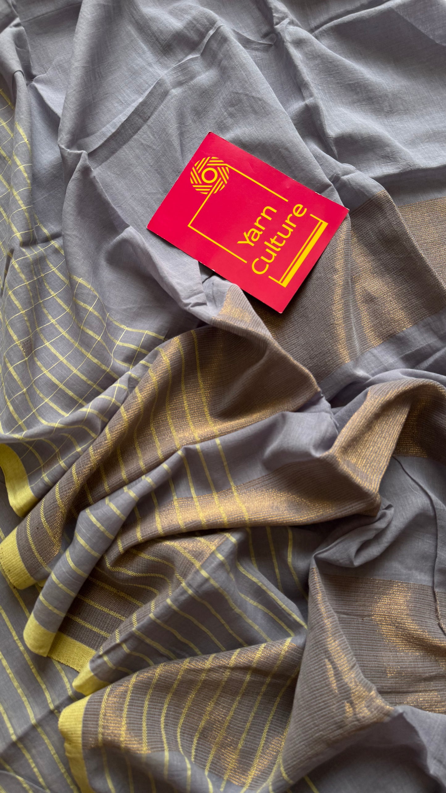 Grey handloom mul saree with custard yellow checkered borders and antique gold buttas - YCBCMCFE387