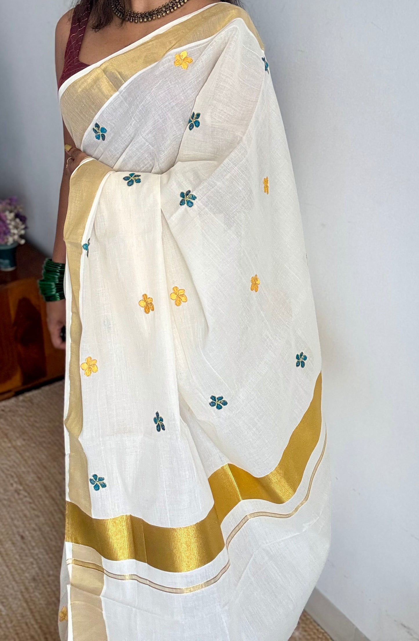 Ivory and gold saree with peacock blue and yellow floral embroidery - YCIEKCFE309