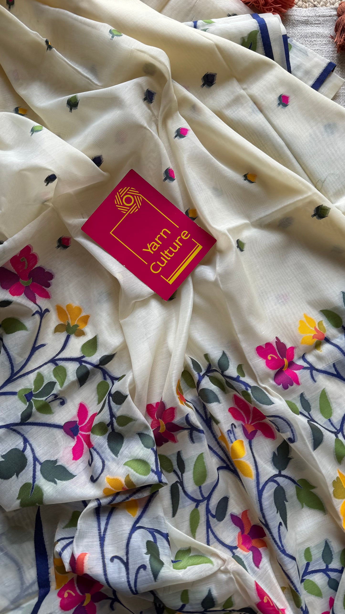 Ivory with navy blue border and multicolour floral motifs, cotton saree - YCIEBCFE325