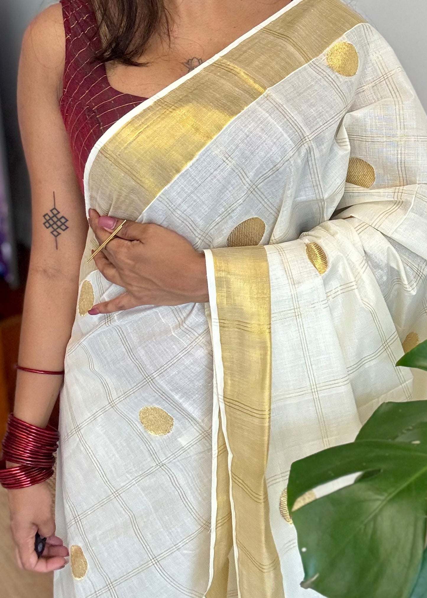 Ivory and gold kerala saree with gold buttas and checks - YCIEON41