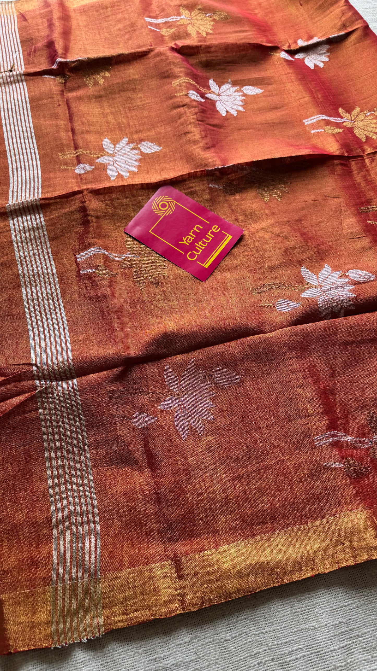 Handwoven orange gold dual tone tissue linen saree with lotus motifs - YCBCLTFE399