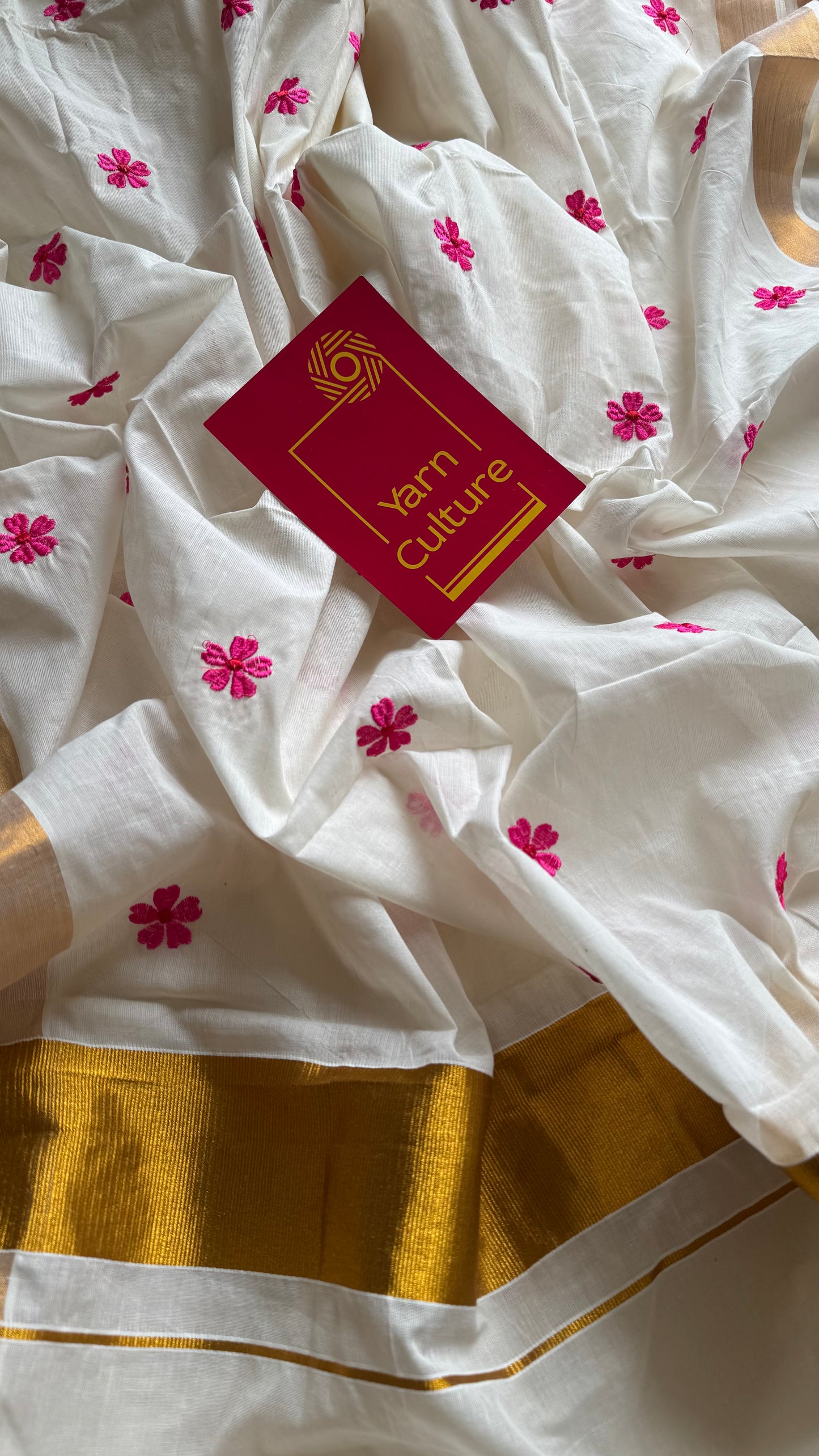 Ivory and antique gold soft cotton kasavu saree, pink parijat floral embroidery - YCIEON155