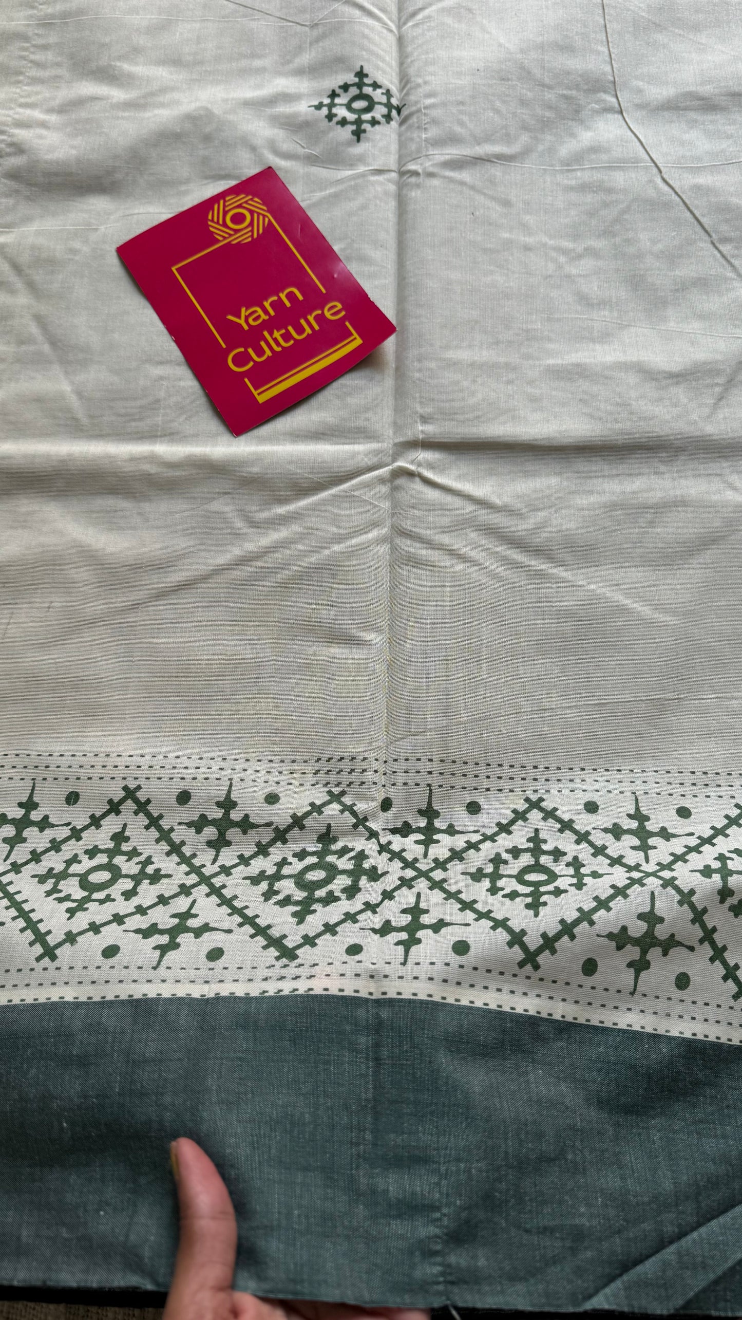 Ivory Kerala cotton saree with green Kutch-inspired printed borders and green centre pleats - YCIEKCFE314