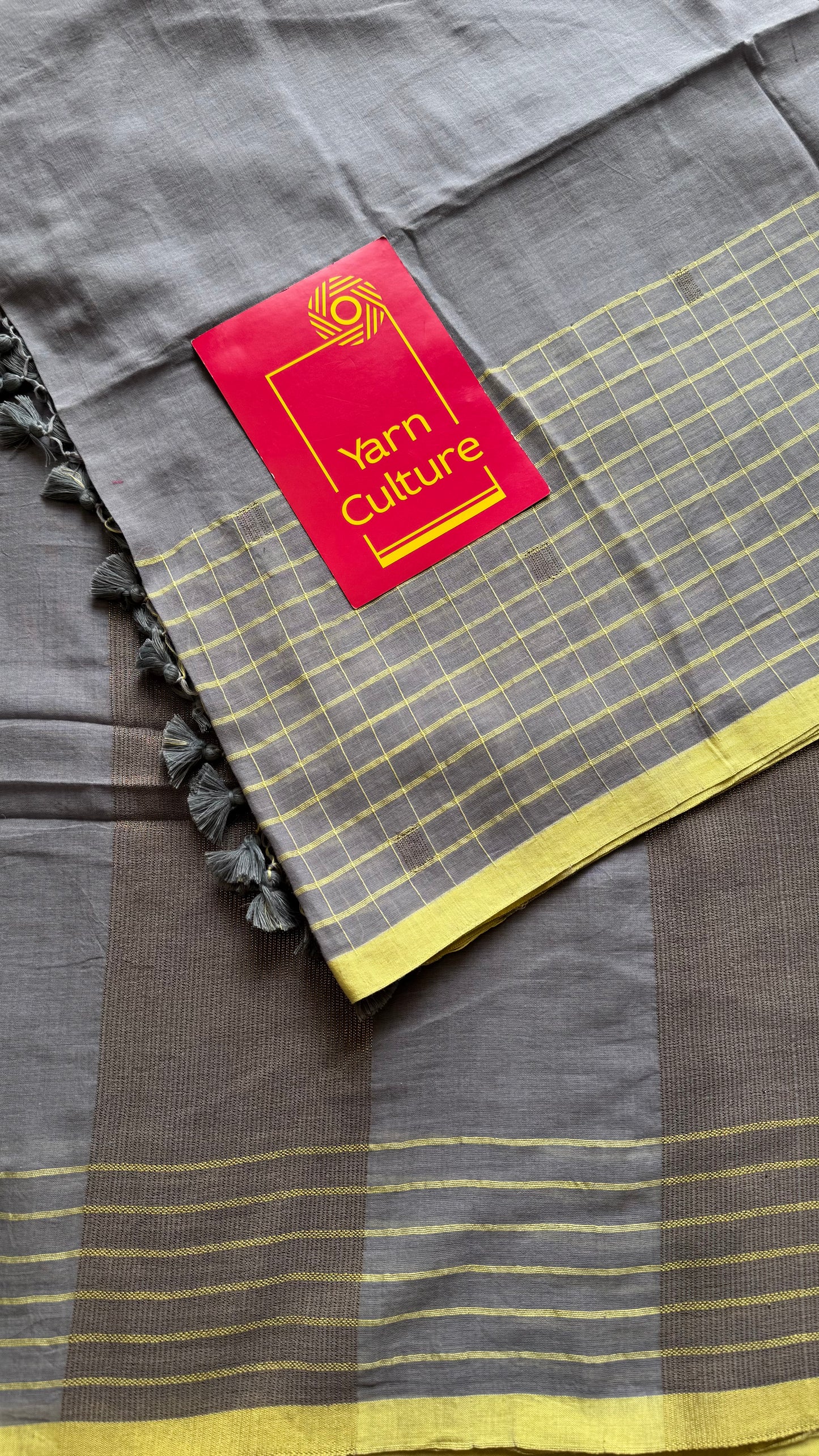 Grey handloom mul saree with custard yellow checkered borders and antique gold buttas - YCBCMCFE387