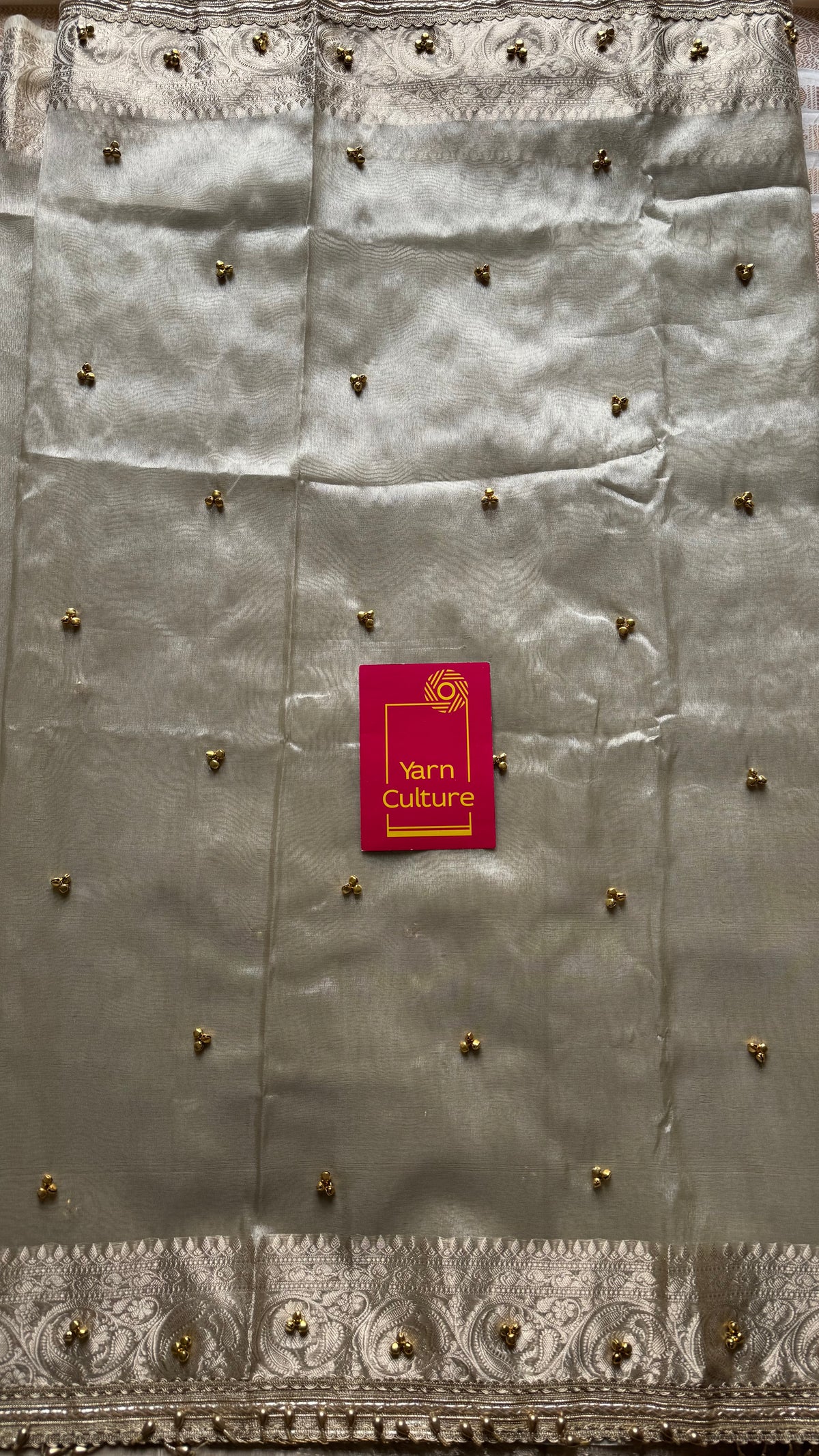Ivory gold tissue Banarasi saree with ghungroo embellishments and beaded lace zari border - YCBLTOC70