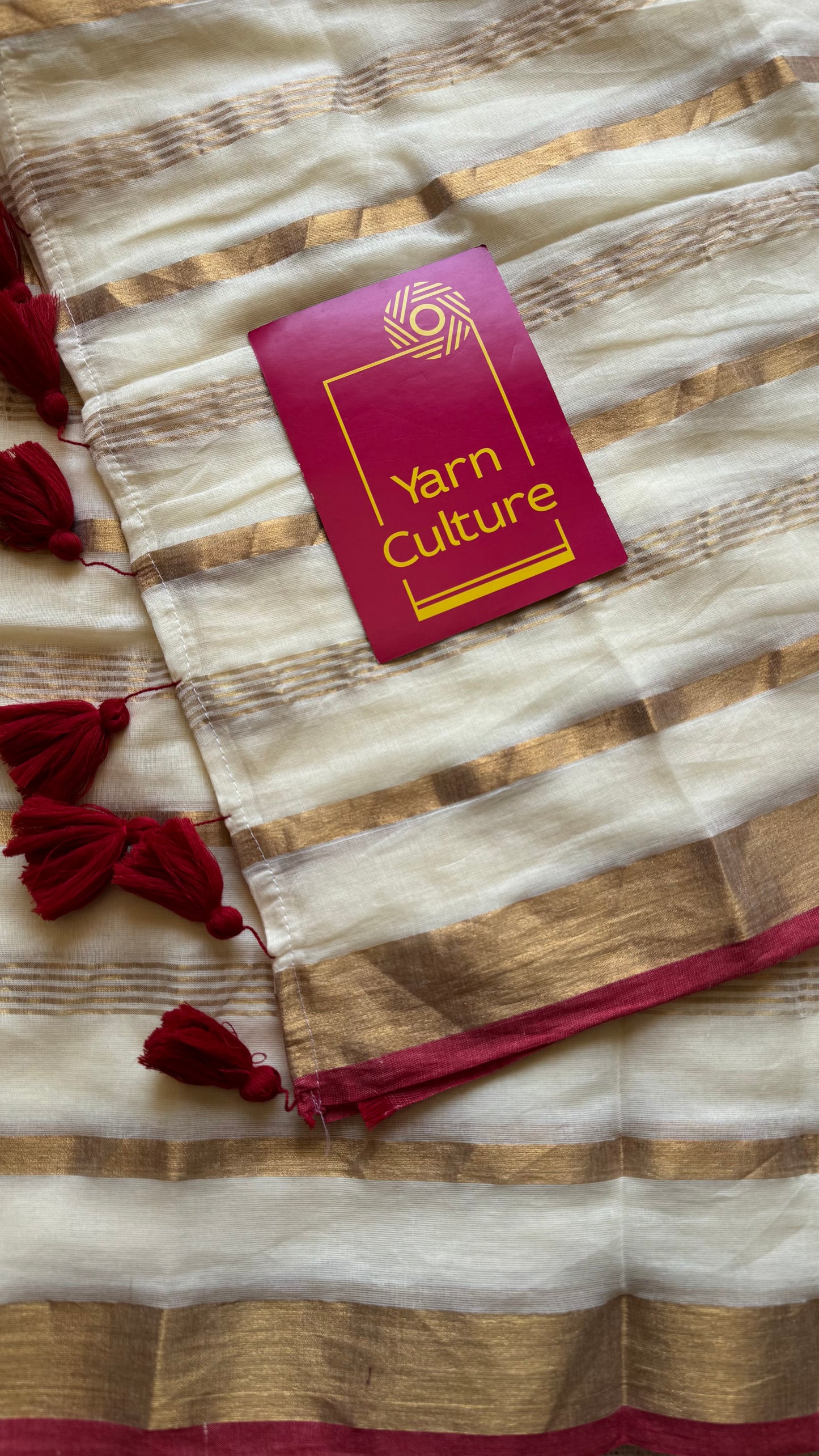 Ivory mul saree with gold stripes and red border - YCIEBCFE327