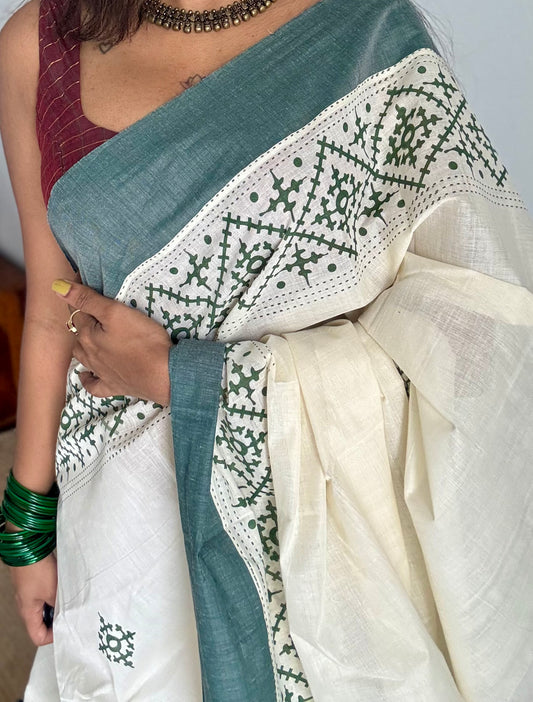 Ivory Kerala cotton saree with green Kutch-inspired printed borders and green centre pleats - YCIEKCFE314