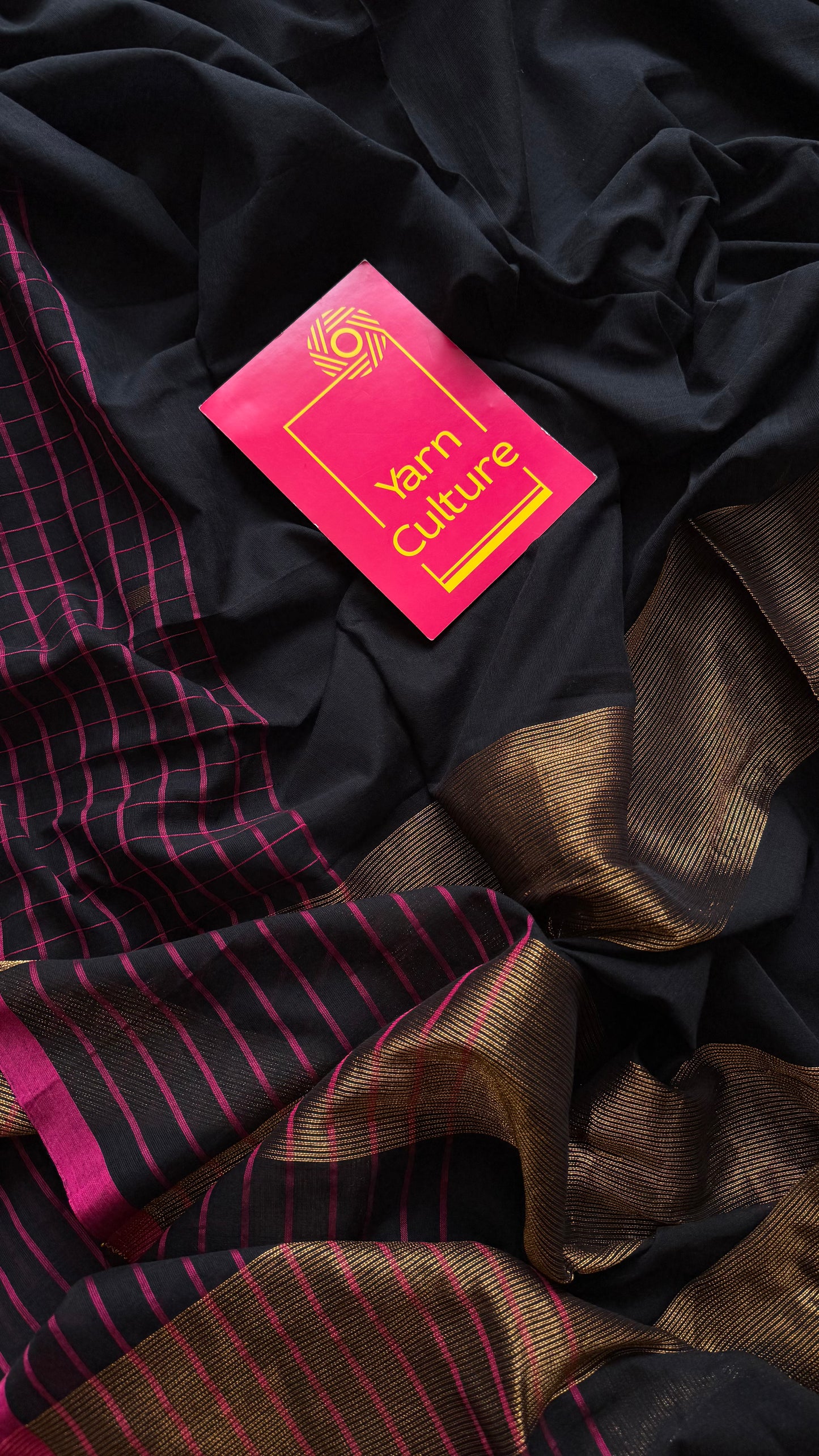 Black handloom mul saree with pink checkered borders and antique gold buttas - YCBCMCFE385