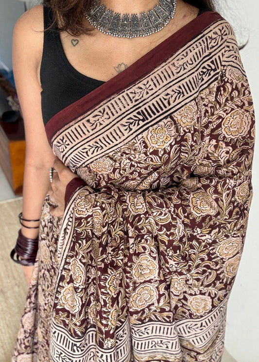 Dark maroon kalamkari, yellow floral vines, floral motif pallu