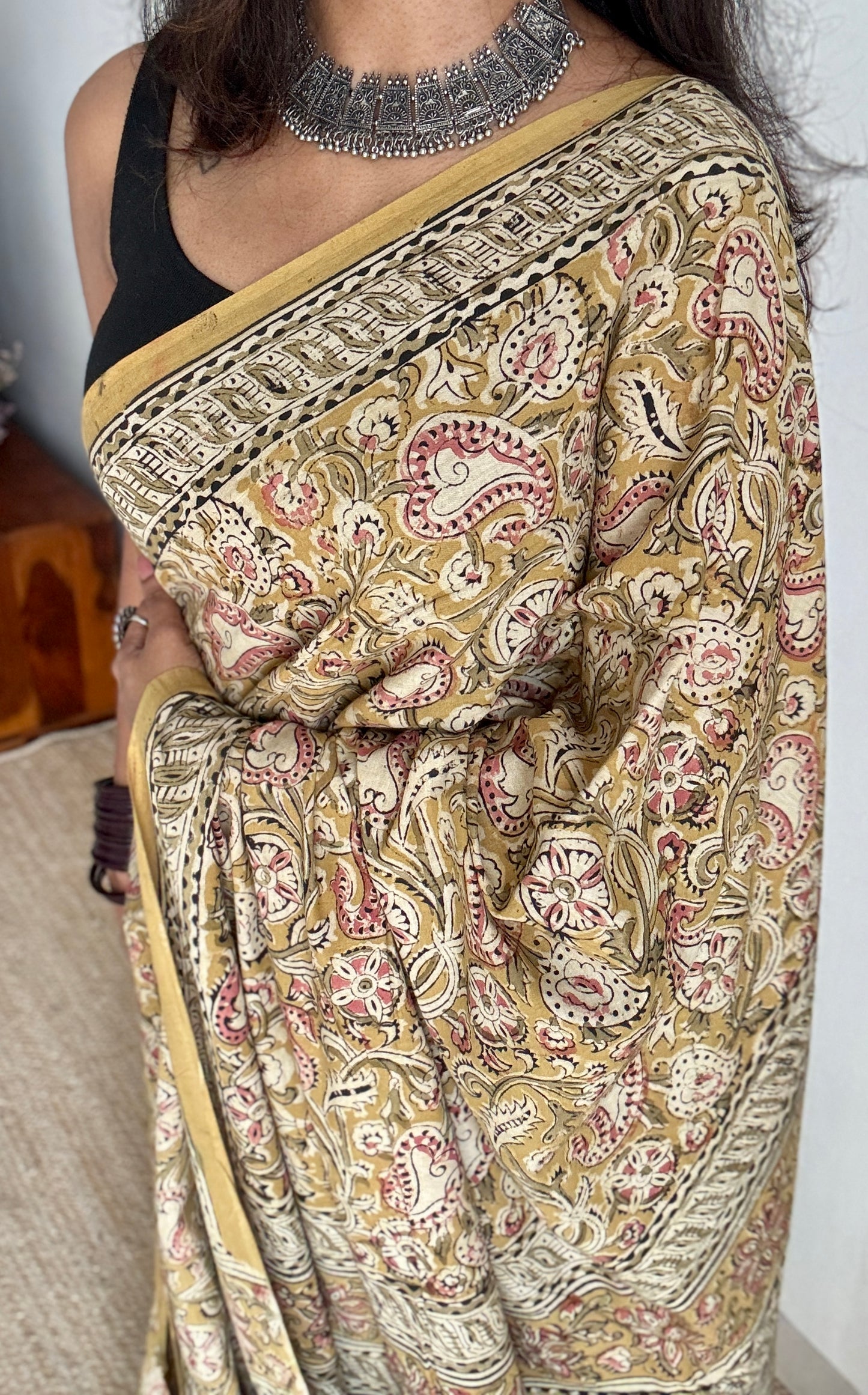 Ginger yellow kalamkari, pink floral vines, floral motif pallu