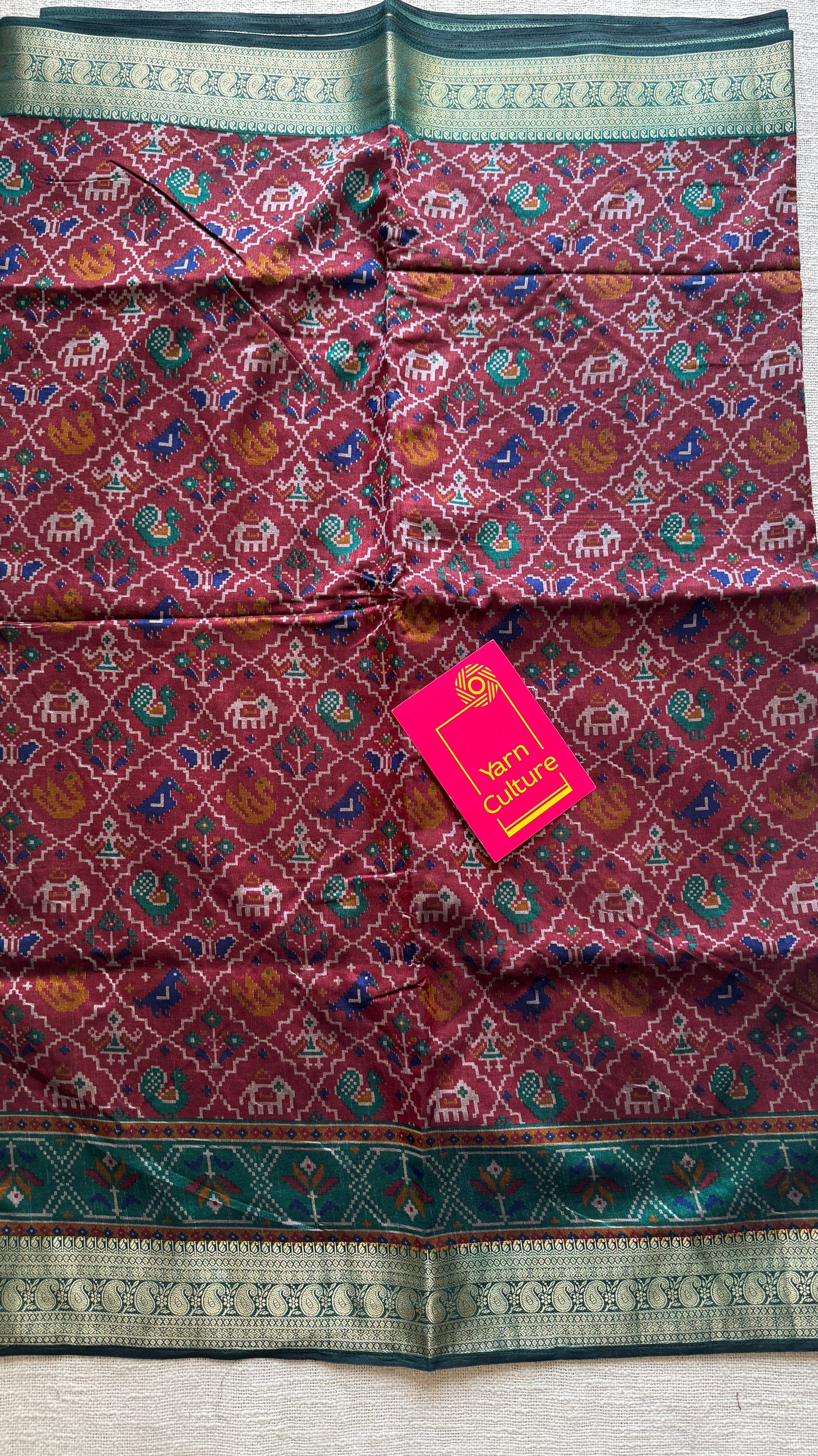 Maroon with green in patola pattern - dola silk
