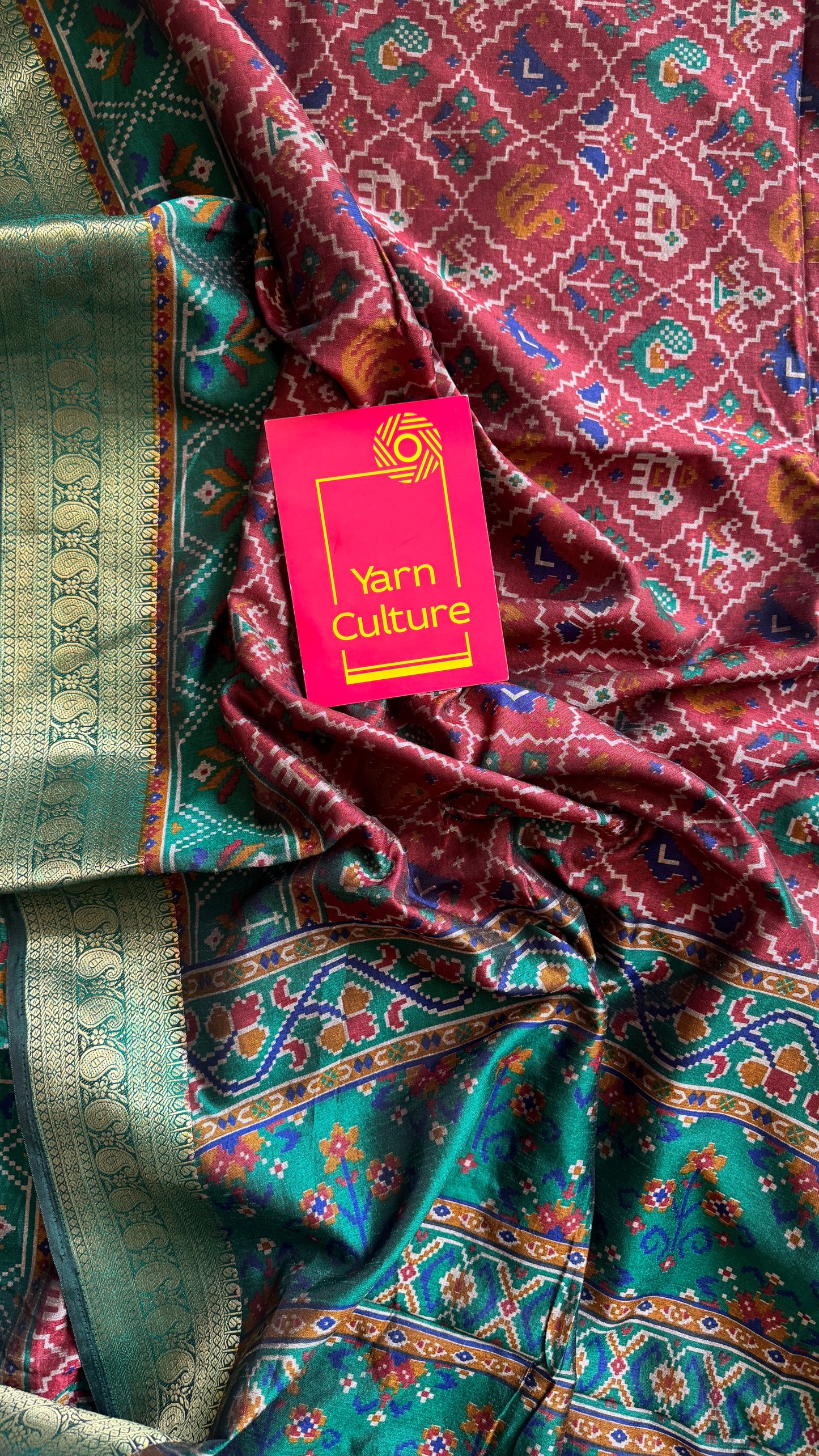 Maroon with green in patola pattern - dola silk