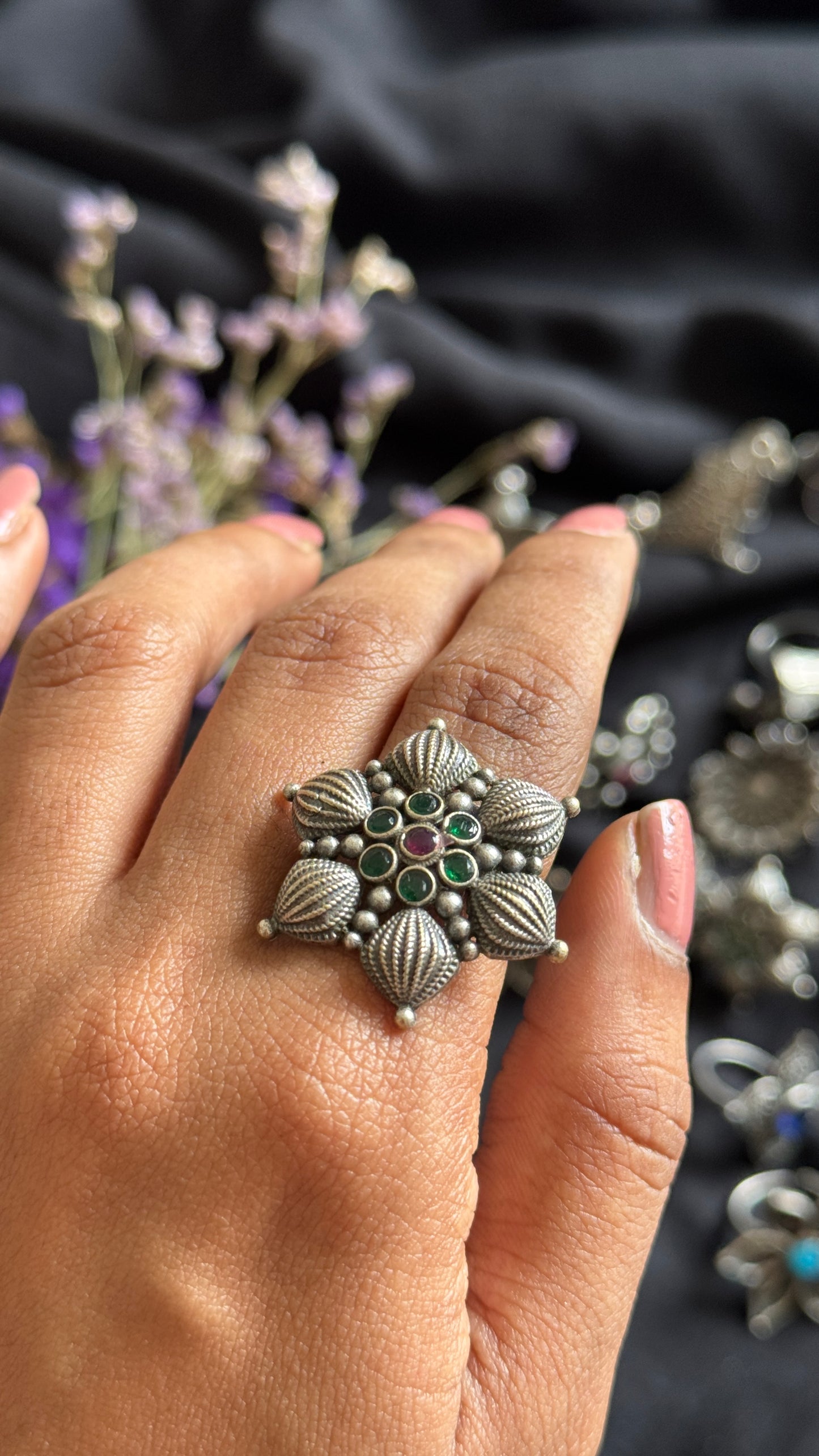 Adjustable floral petal ring - green red stones