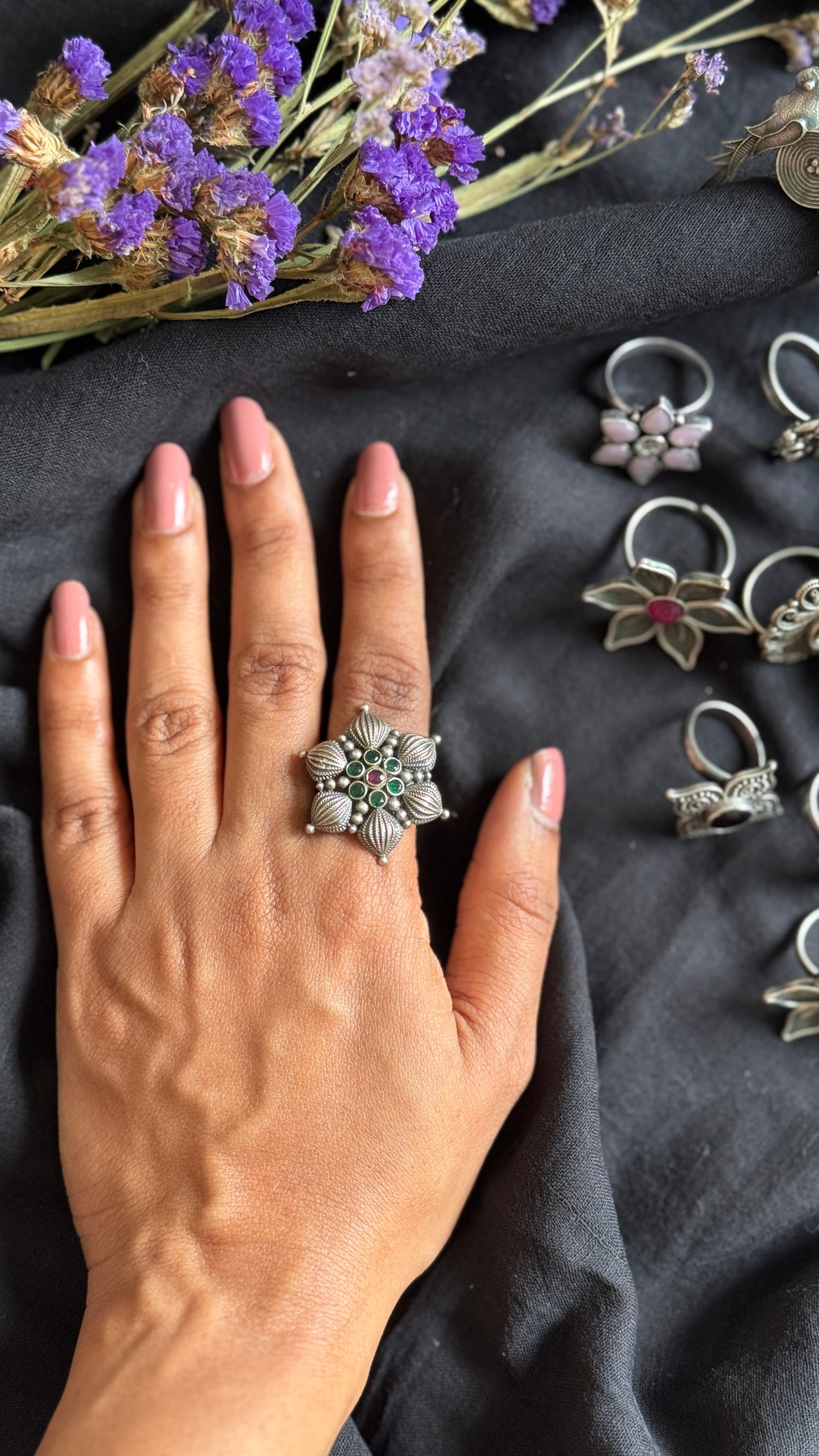 Adjustable floral petal ring - green red stones