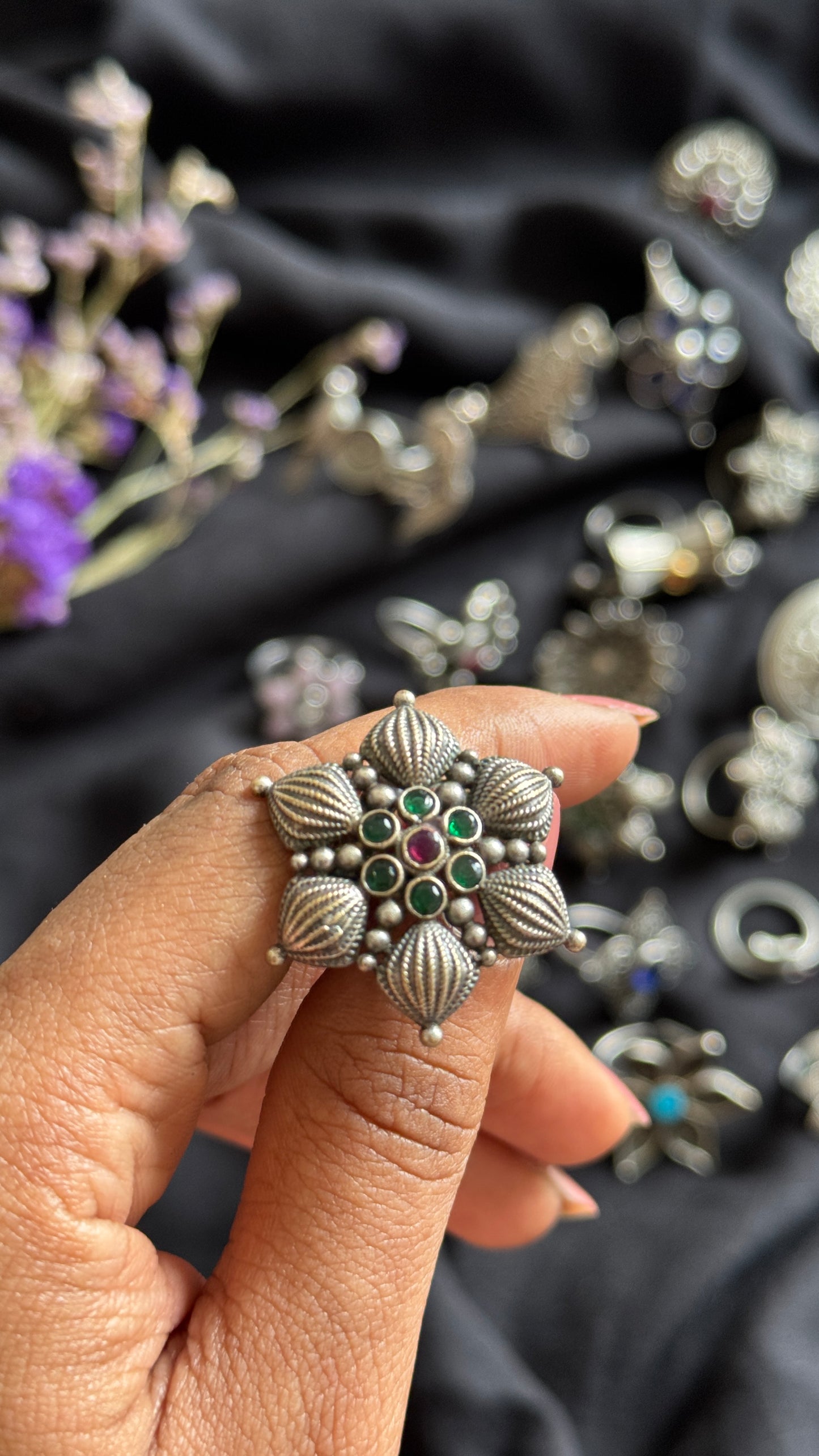 Adjustable floral petal ring - green red stones