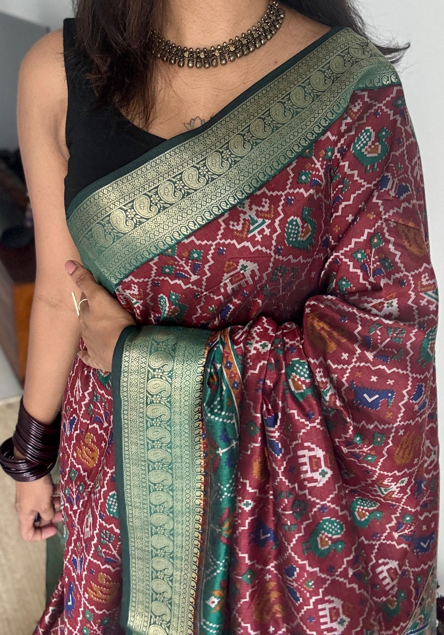 Maroon with green in patola pattern - dola silk