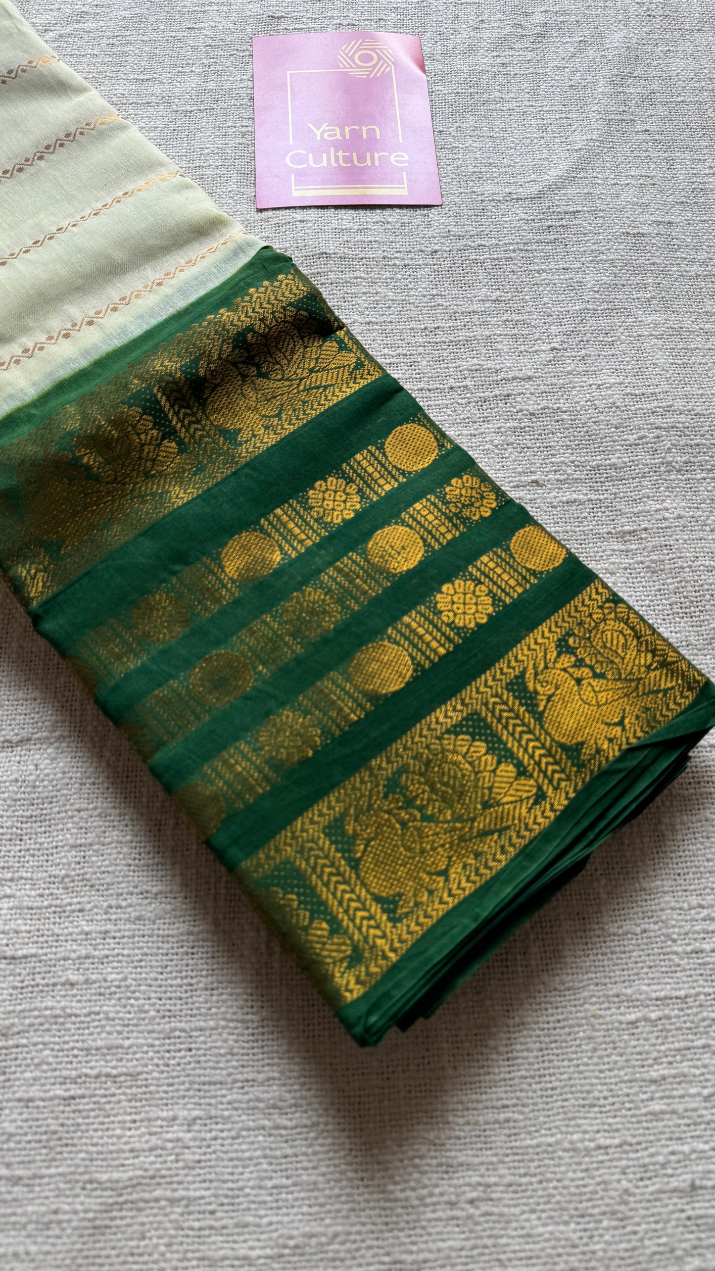 Offwhite and green sungudi with peacock motif rettai pettu wide border